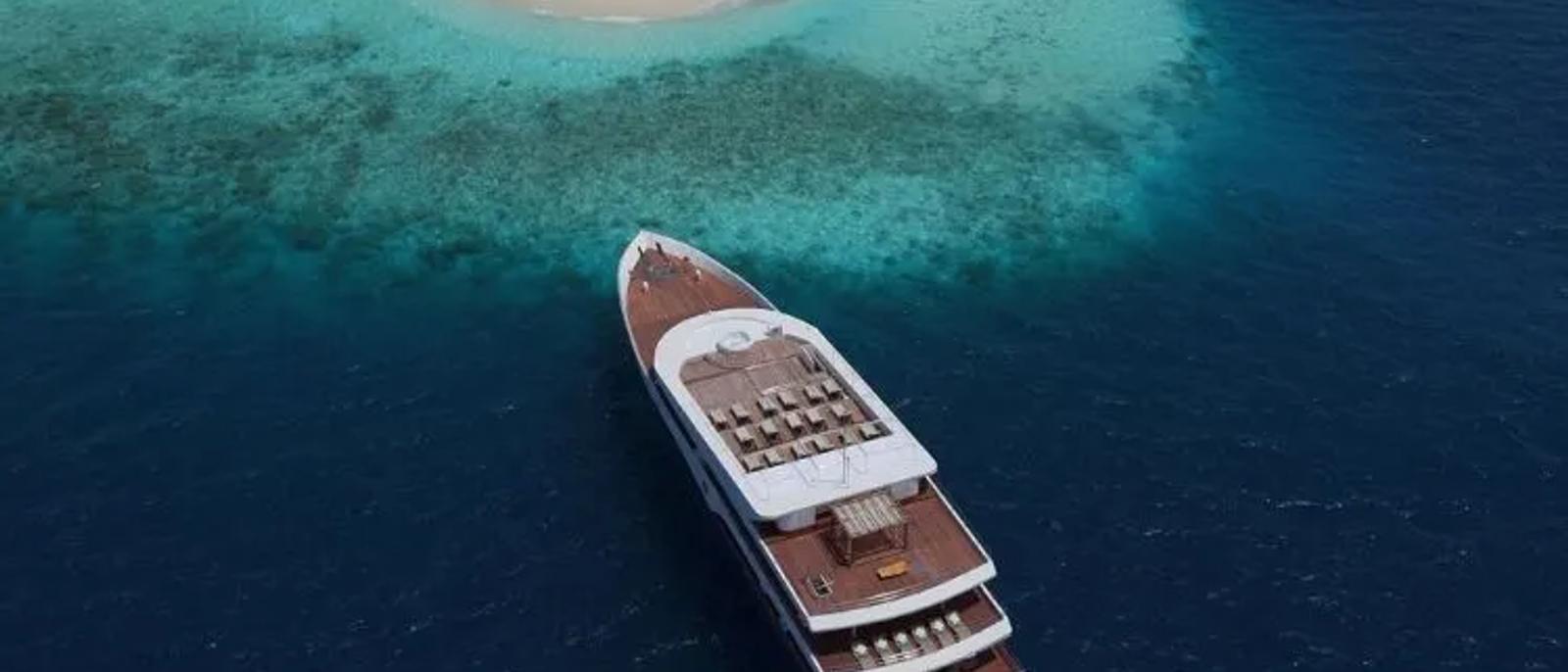 Luxury yacht transfer approaching a Maldives resort island