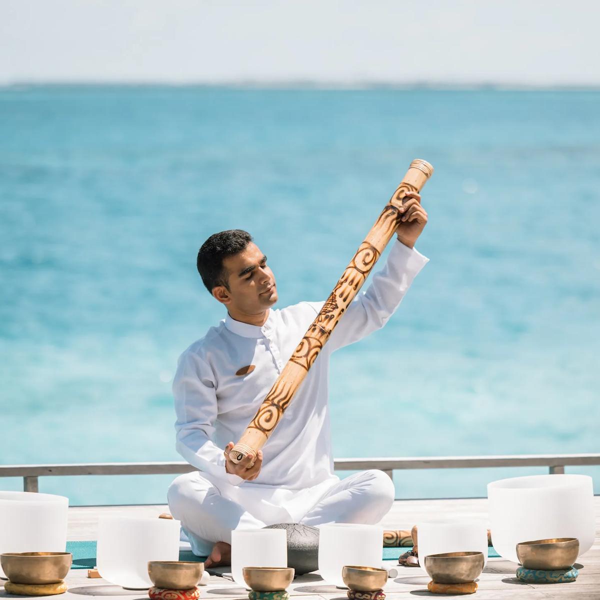 A sound-healing session on the Skye Deck — the official site has no separate food-and-drink photography for this venue, so this spa-context image stands in