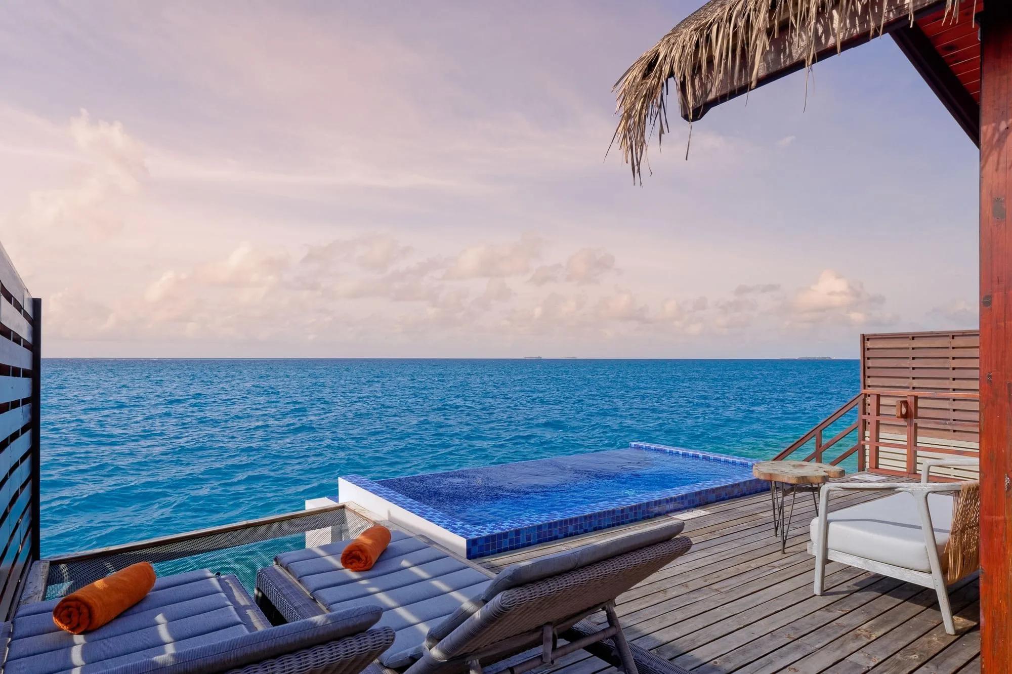 The deck and sunlounger of a Reef Pool Water Villa, built for direct house-reef access