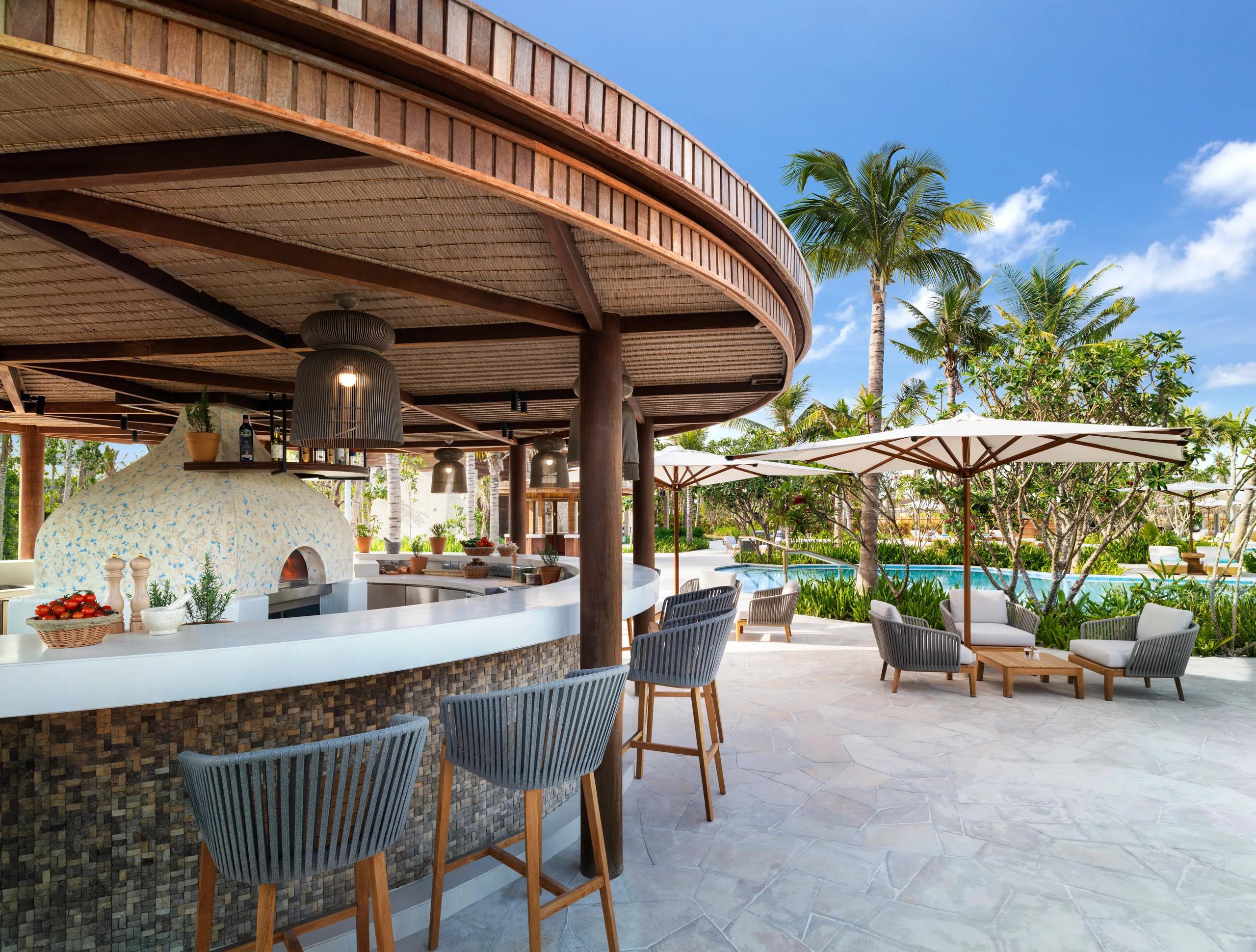 The poolside deck at Nava, Waldorf Astoria Maldives Ithaafushi's all-day beach club