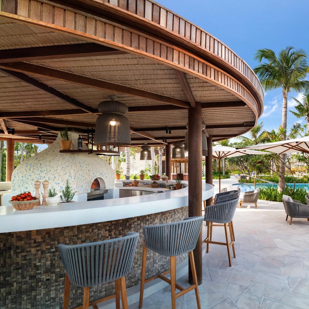 The poolside deck at Nava, Waldorf Astoria Maldives Ithaafushi's all-day beach club