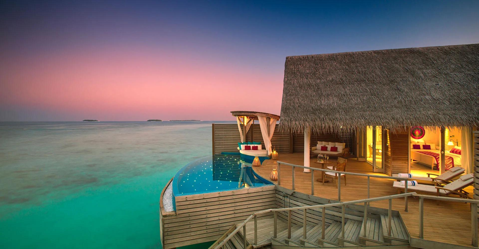 Exterior of an overwater Water Pool Villa at Milaidhoo, built on stilts above the lagoon.