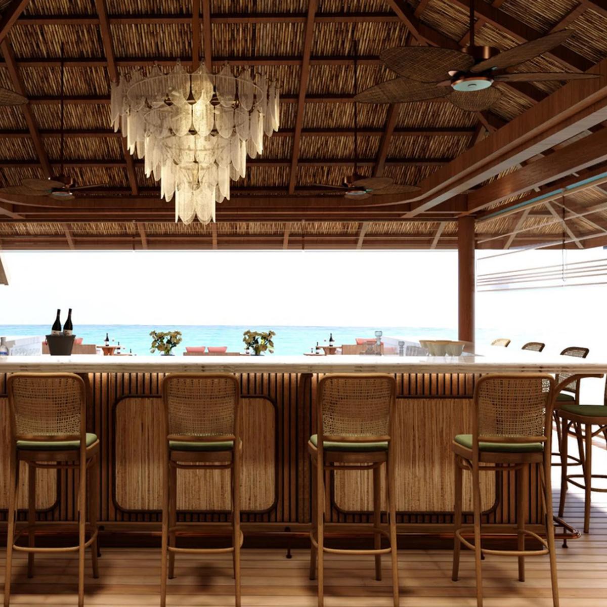 La Tavola's overwater dining room at RAH GILI Maldives — stands in for Maakeyolhu, which has no dedicated photography on the official site