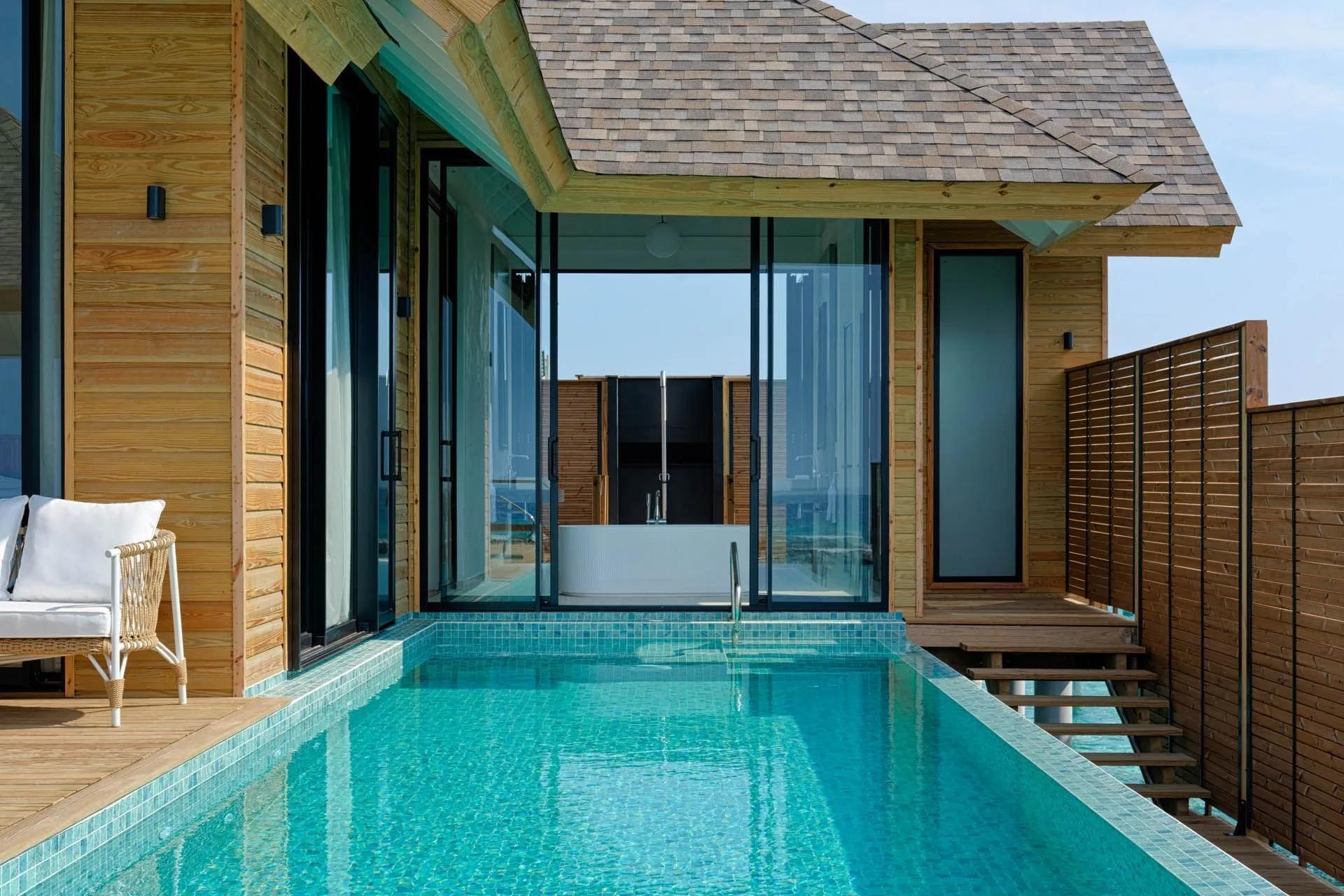 A Deluxe Water Pool Villa Lagoon View's private deck, plunge pool and ladder into the water