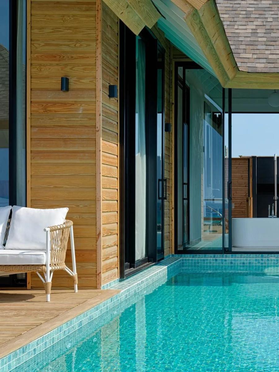 A Deluxe Water Pool Villa Lagoon View's private deck, plunge pool and ladder into the water