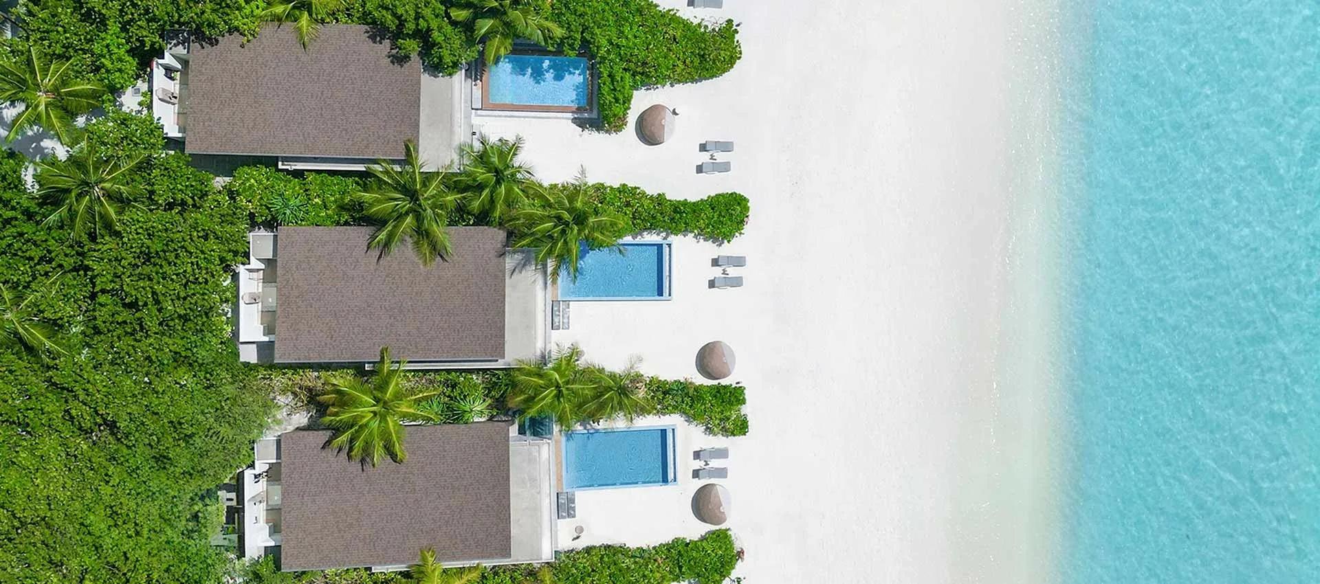 The Sunrise Beach Villa's private pool and terrace, steps from the sand
