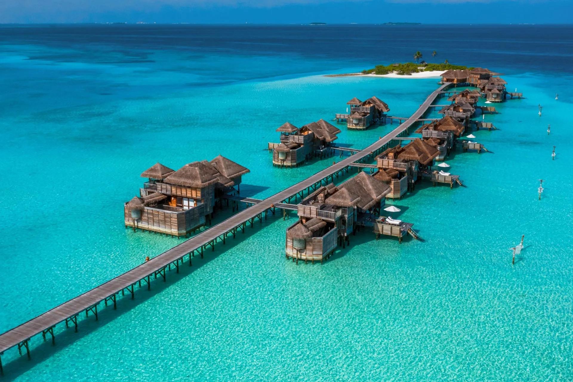 Aerial view of the jetty and Gili Lagoon Villas over the open lagoon at Gili Lankanfushi