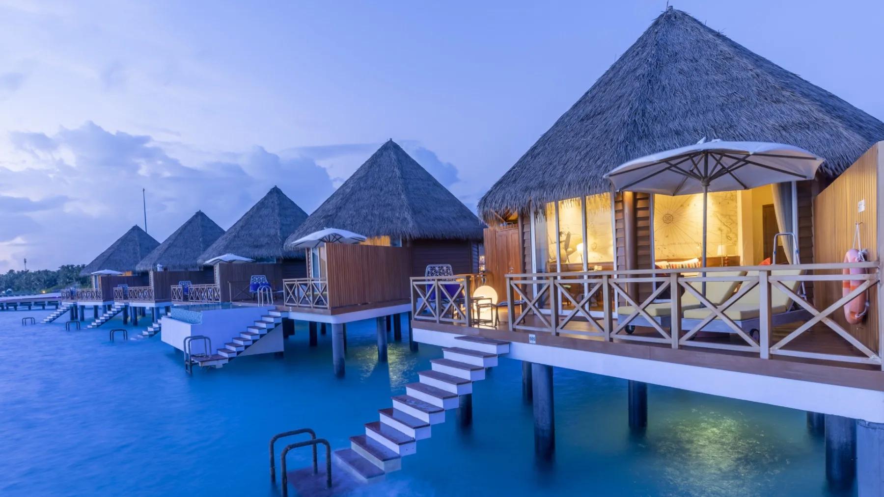 An Overwater Villa's deck and lagoon view at Mercure Maldives Kooddoo Resort