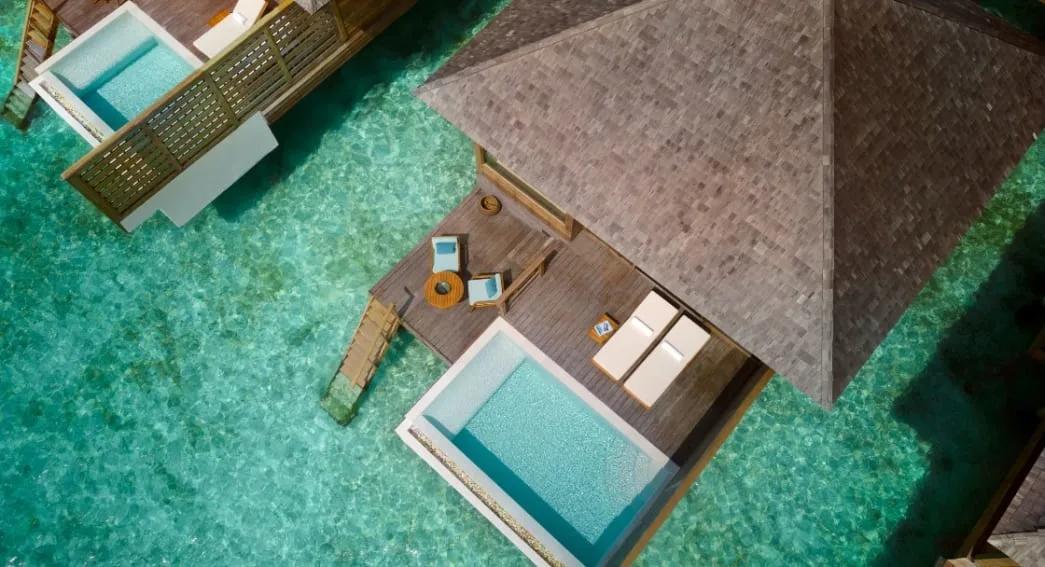 Aerial view of an Over Water Pool Villa's split-level deck and private pool above the lagoon