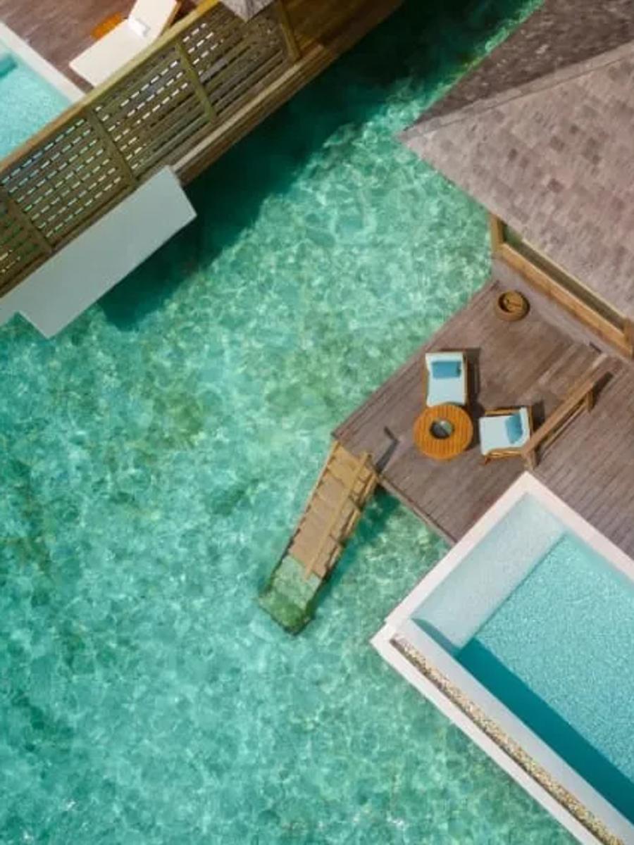 Aerial view of an Over Water Pool Villa's split-level deck and private pool above the lagoon