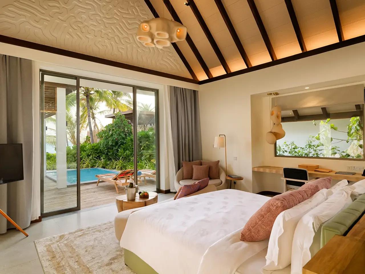 A Beach Pool Villa's plunge pool and sun loungers on its private beachfront terrace