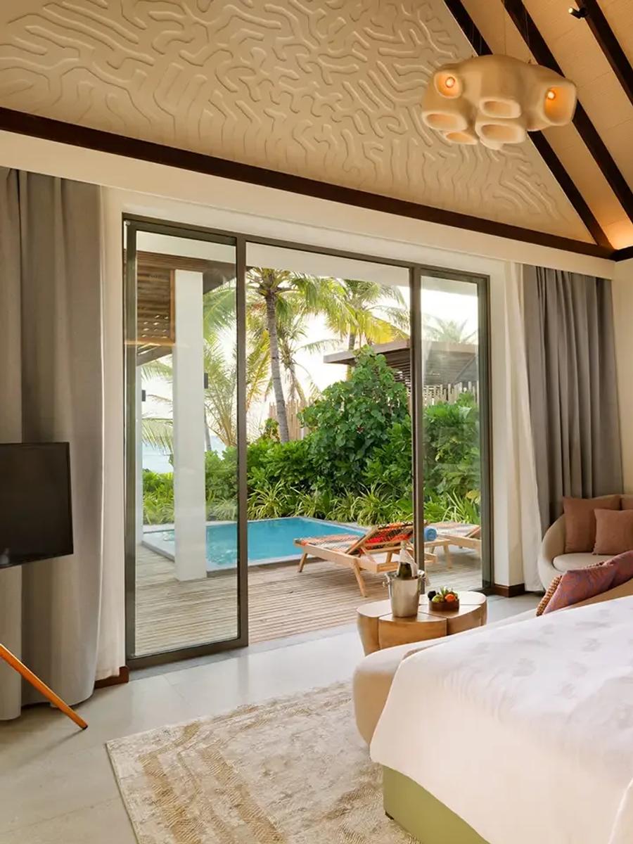 A Beach Pool Villa's plunge pool and sun loungers on its private beachfront terrace