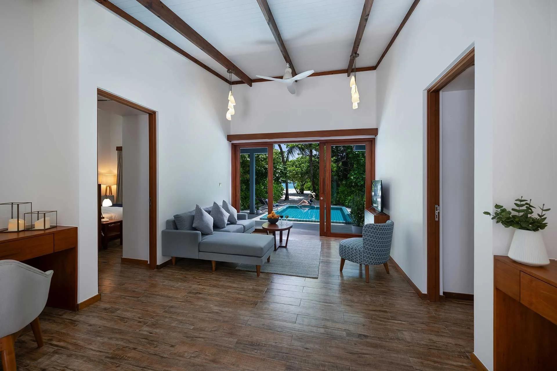 The living area inside a Sunset Two Bedroom Villa with Pool at Ifuru Island Maldives