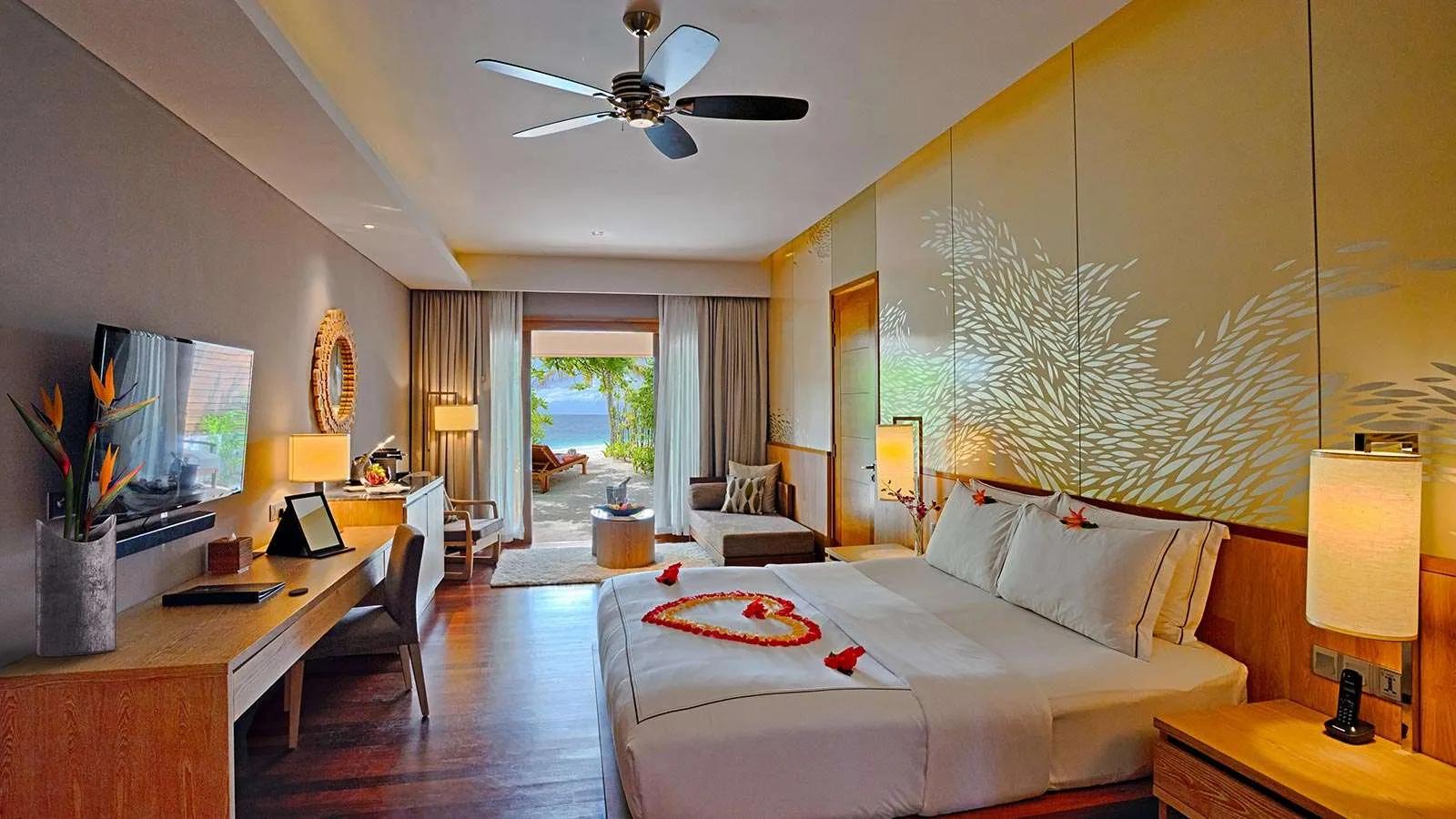 The bedroom of a Beach Suite at Lily Beach Resort & Spa