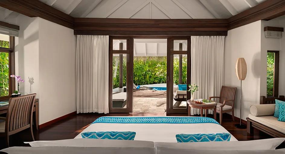 Bedroom interior of a Sunrise Beach Pool Villa at Anantara Dhigu