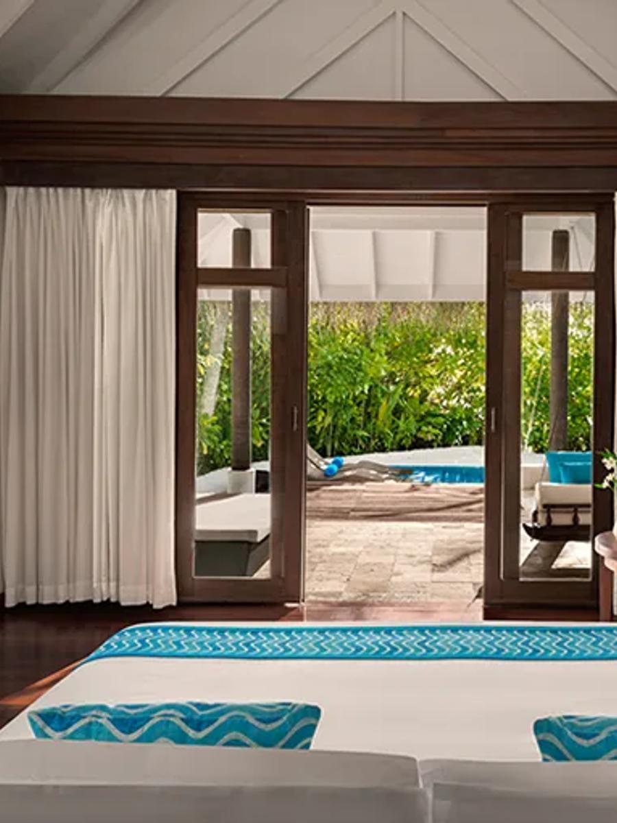 Bedroom interior of a Sunrise Beach Pool Villa at Anantara Dhigu