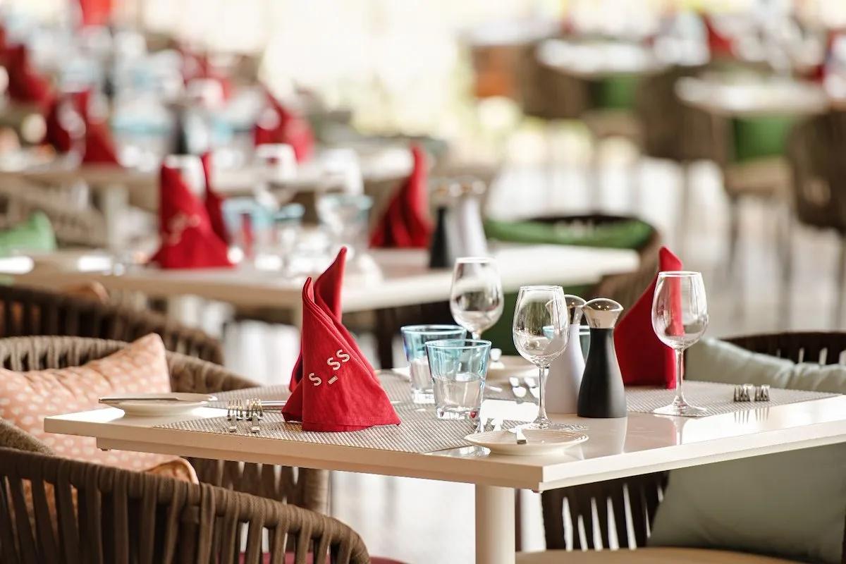 Sessions' open-kitchen dining room, tables set for the evening