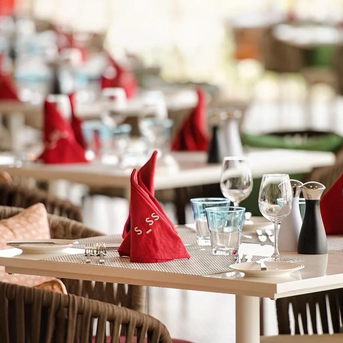 Sessions' open-kitchen dining room, tables set for the evening