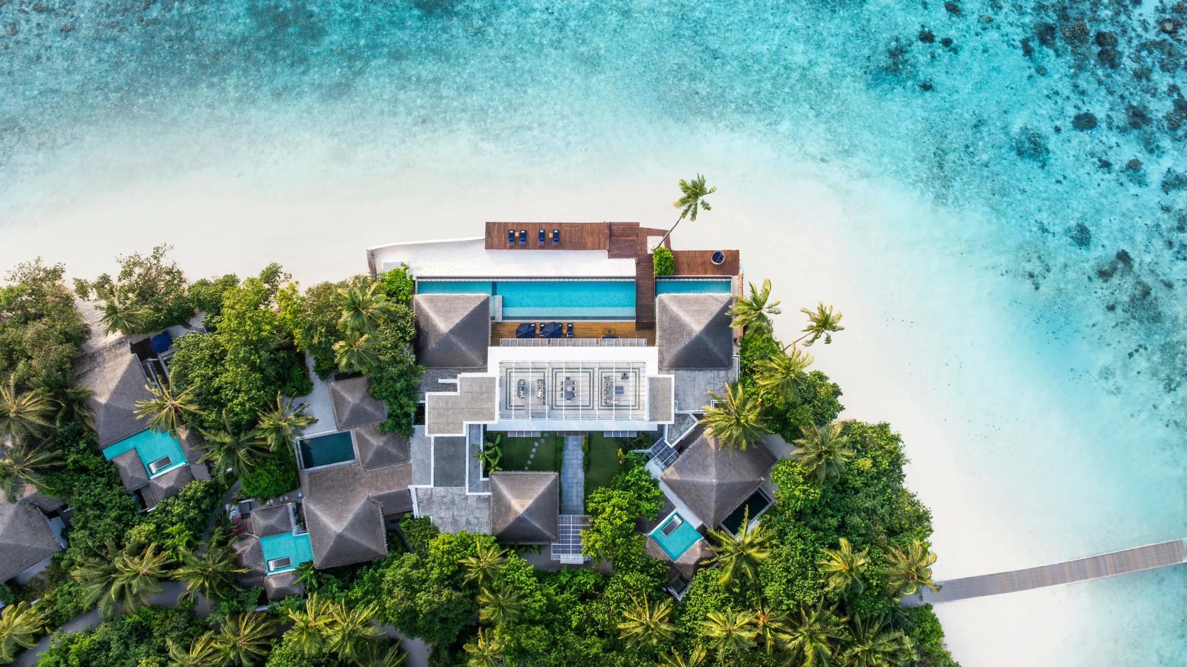 The Halcyon Grand Estate seen from above, its rooftop terrace and full-width pool visible