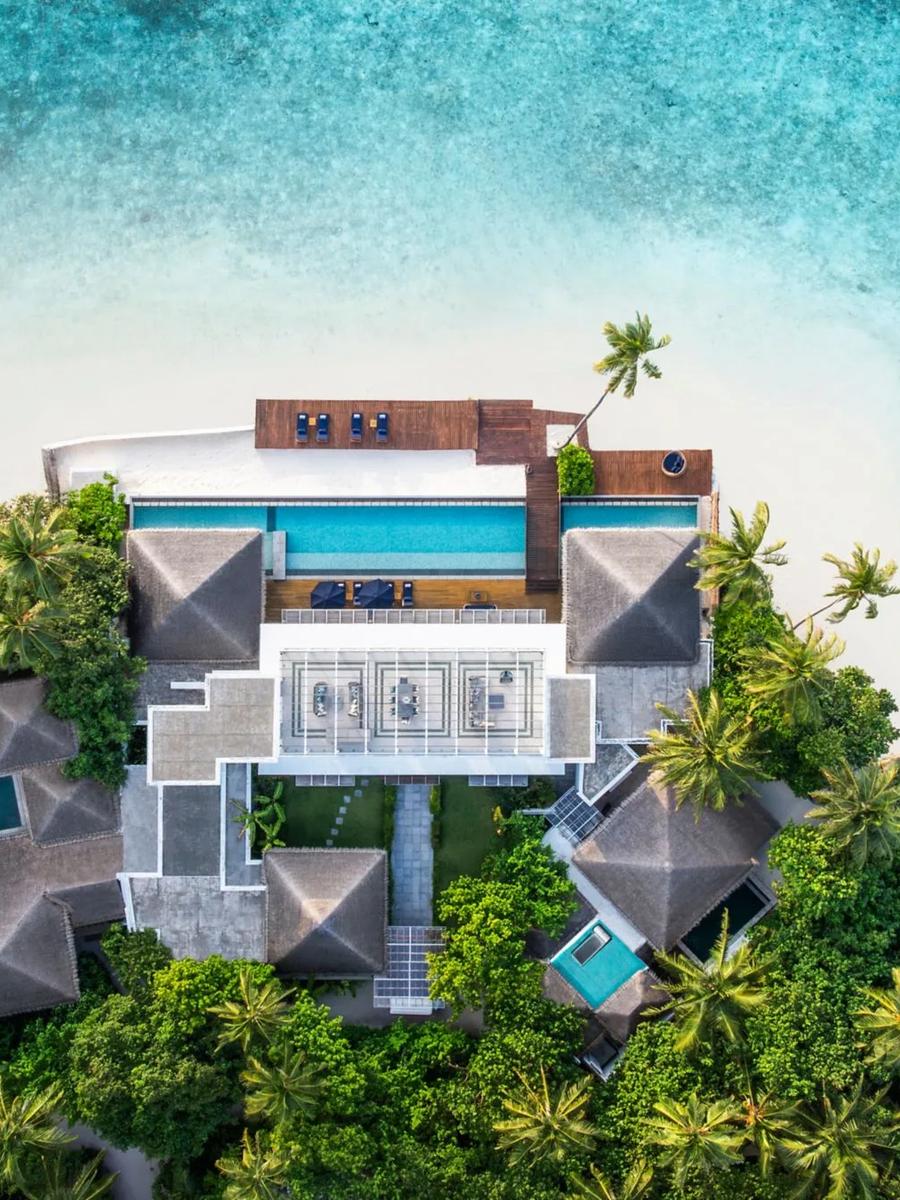 The Halcyon Grand Estate seen from above, its rooftop terrace and full-width pool visible