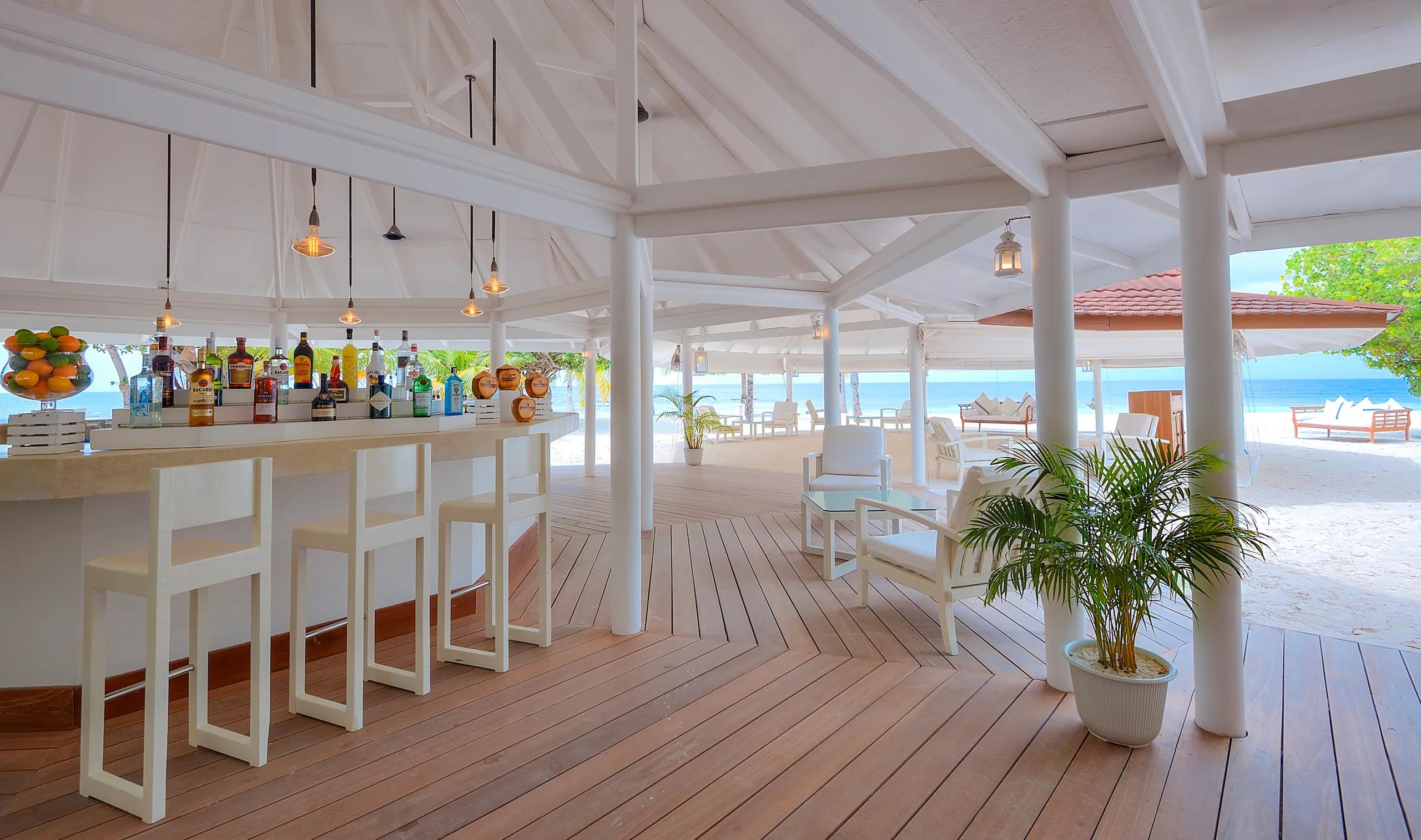 Interior of Boli Beach Bar at Diamonds Athuruga, open to the beach
