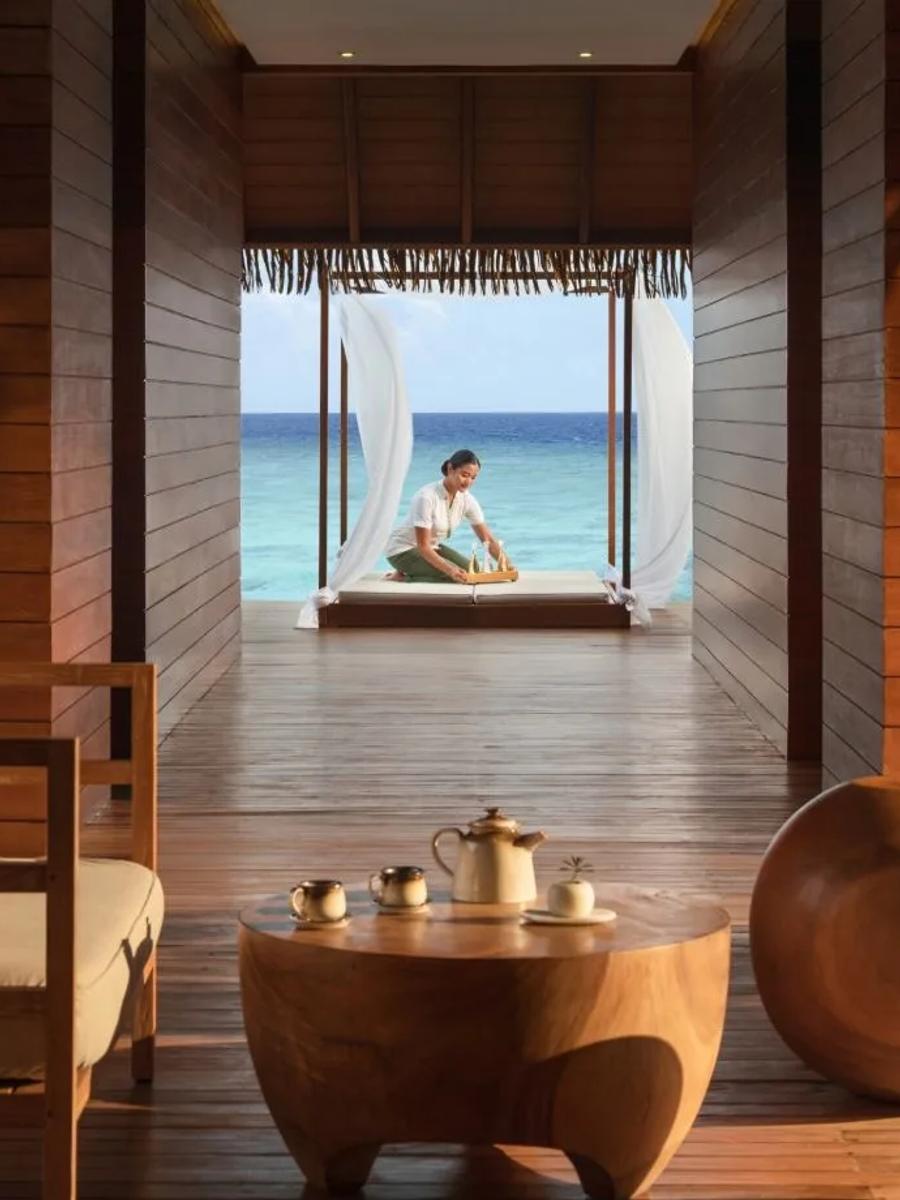 The overwater walkway leading to IASO Medi Spa's treatment deck, open to the lagoon