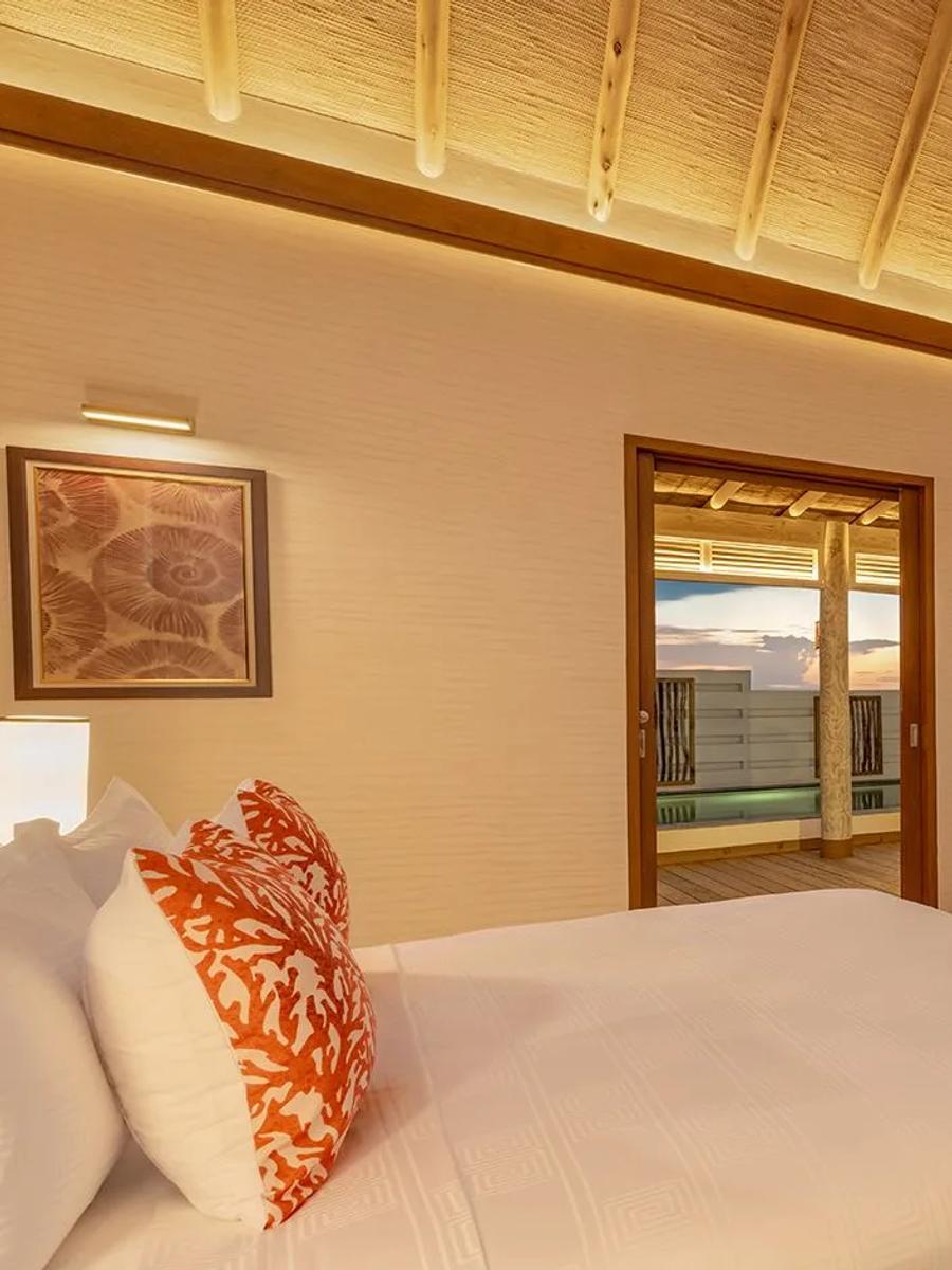 A Sunset Water Pool Villa with Slide at RAH GILI Maldives, overwater and facing the sunset side of the island
