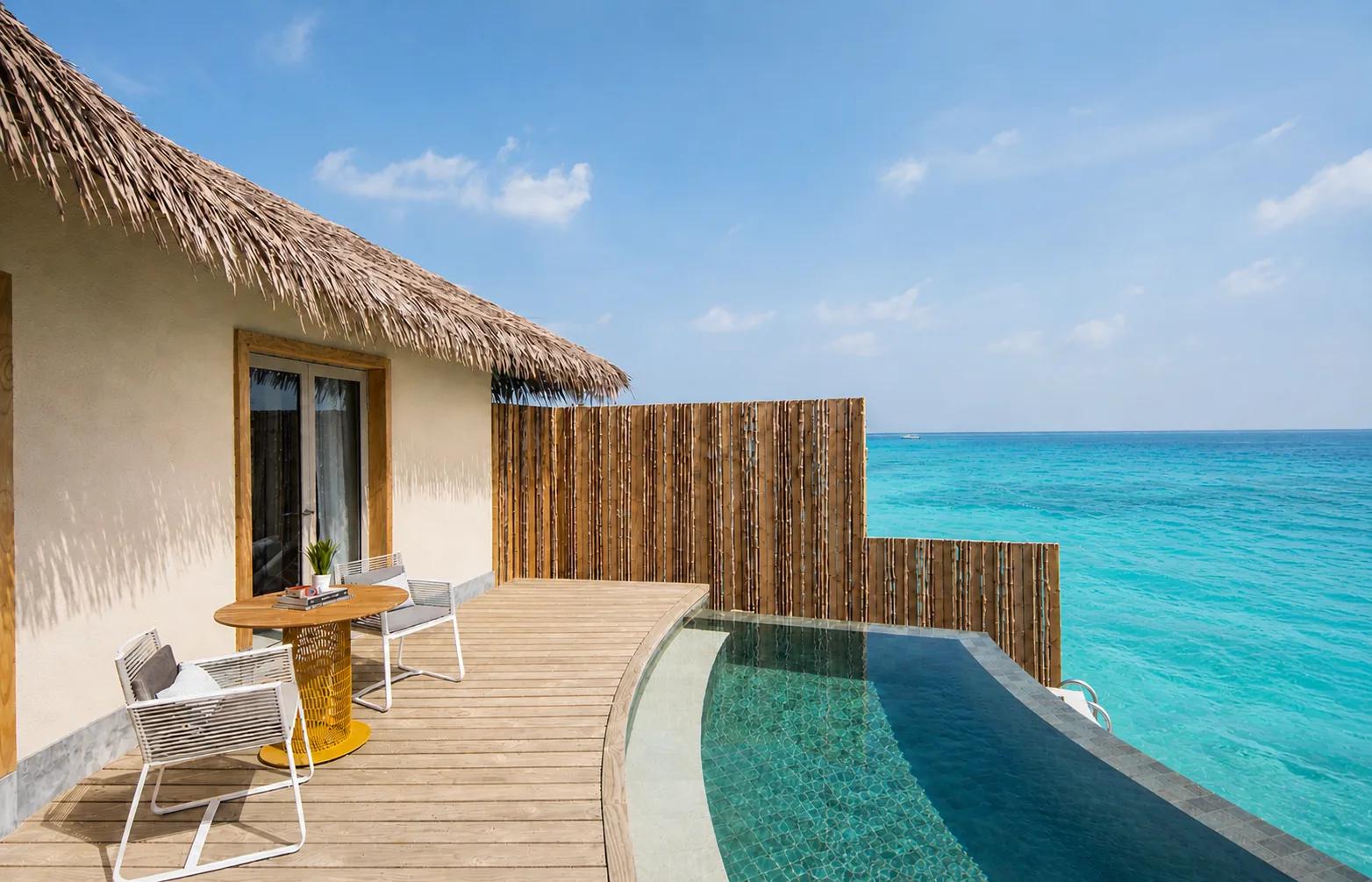 A Sunset Overwater Pool Villa's private pool at the water's edge in daylight