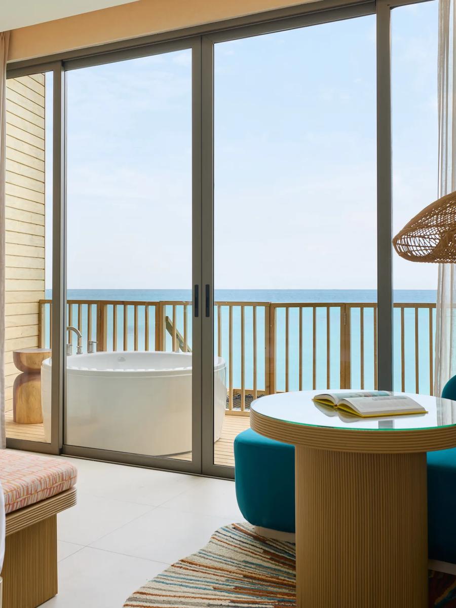 A Mirage Overwater Villa with Jacuzzi, family living area over the lagoon
