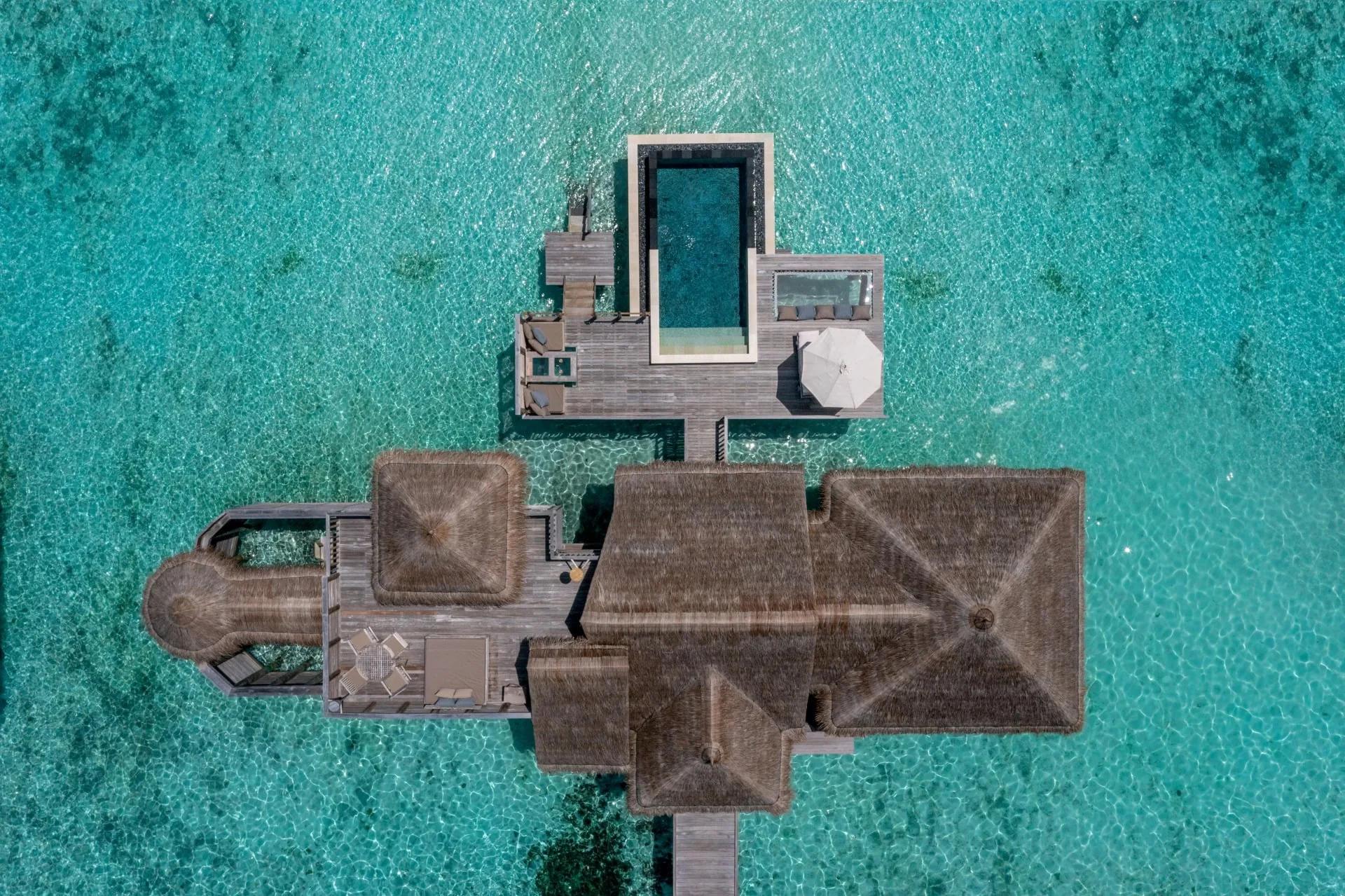 Aerial view of a Villa Suite with Pool at Gili Lankanfushi, showing the extended sundeck and infinity pool