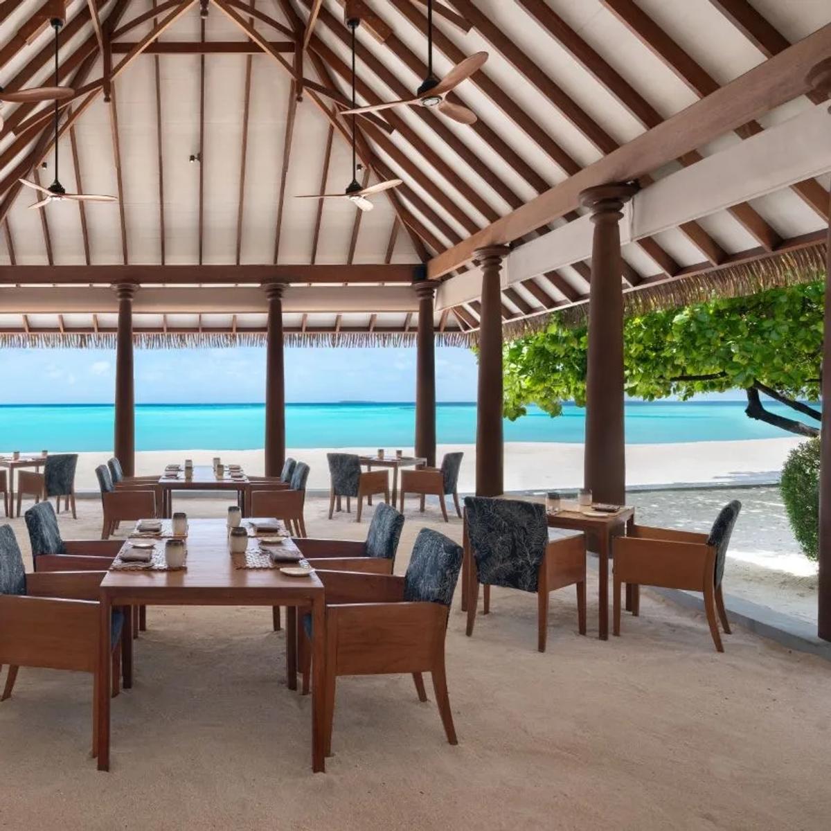 Ranba's open-air, beachfront dining room at Heritance Aarah, tables set facing the lagoon