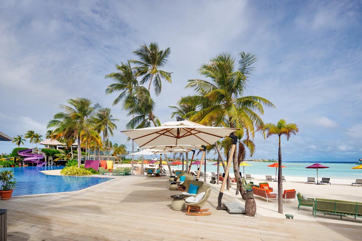 The swim-up Pool Bar built into the main pool, with its waterslide behind