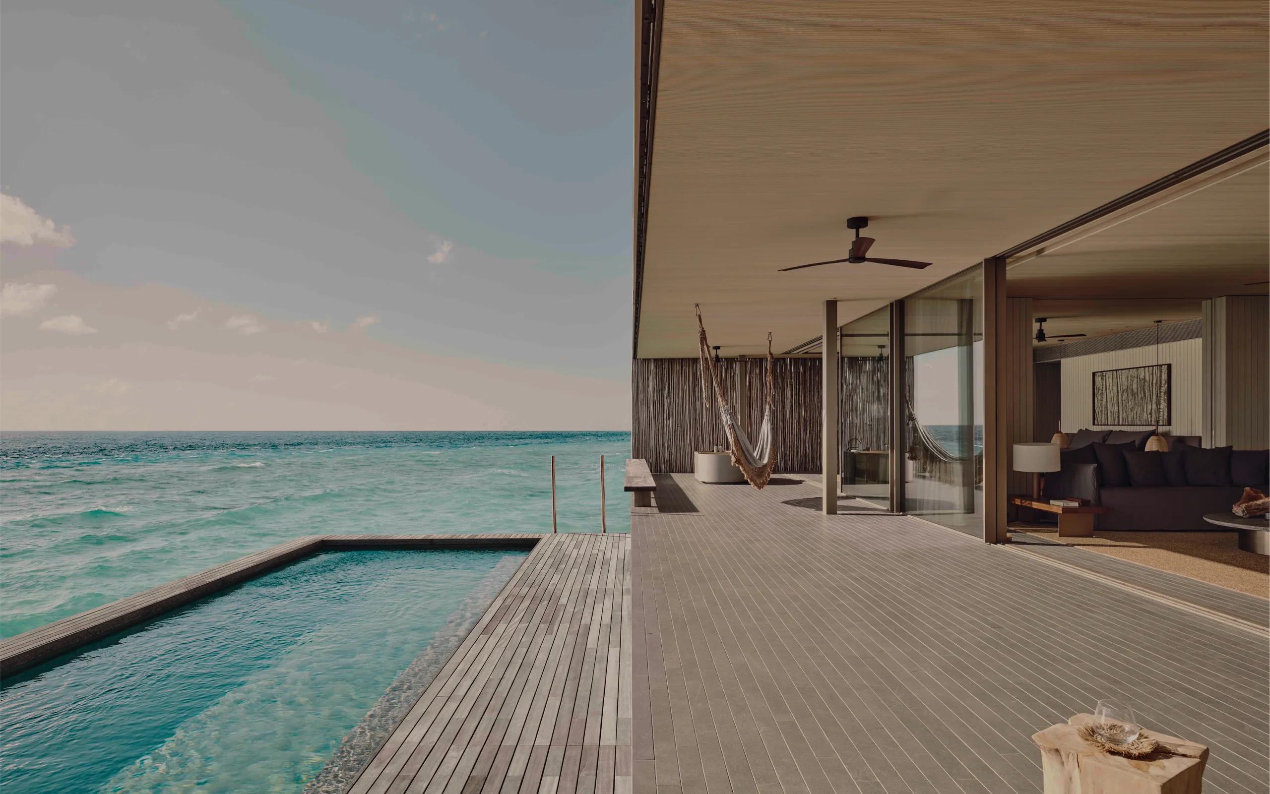 An overwater deck and infinity-edge plunge pool at a Two-Bedroom Water Pool Villa, running straight into the open ocean