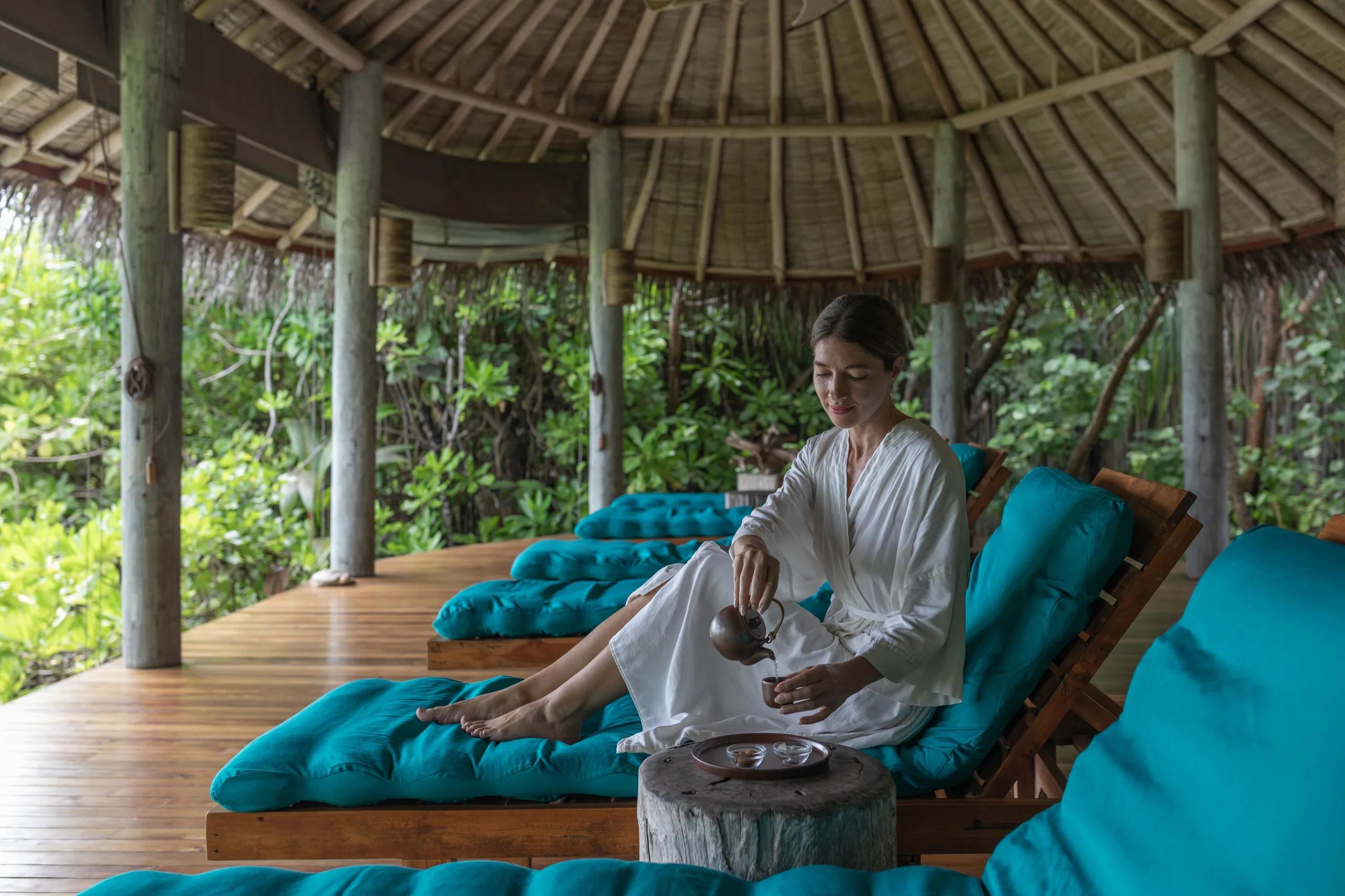 One of the spa's thatched treatment nests, open-sided and set among the trees