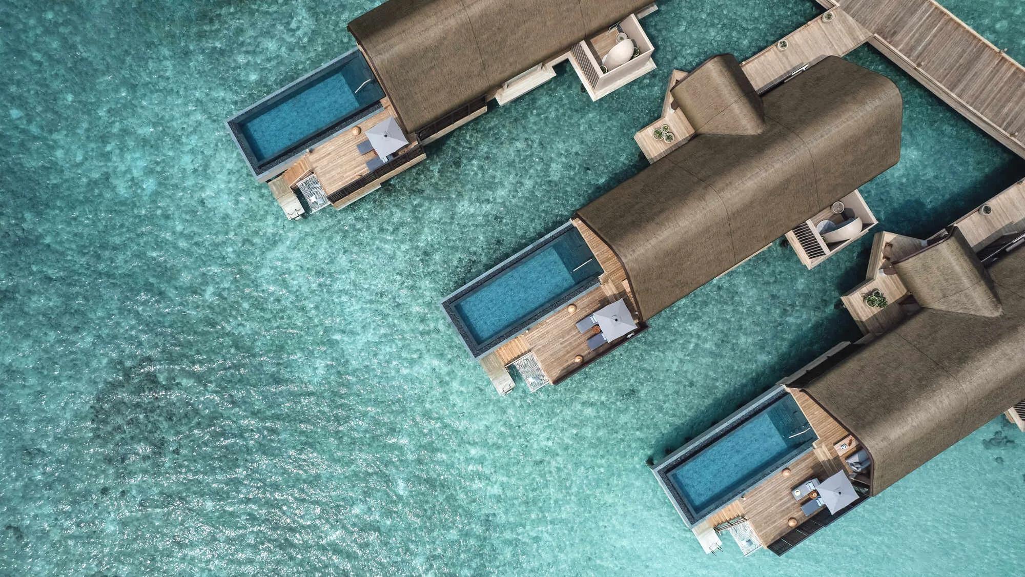 An overwater Ocean Pool Villa at Joali Being, private pool and sundeck extending over the lagoon