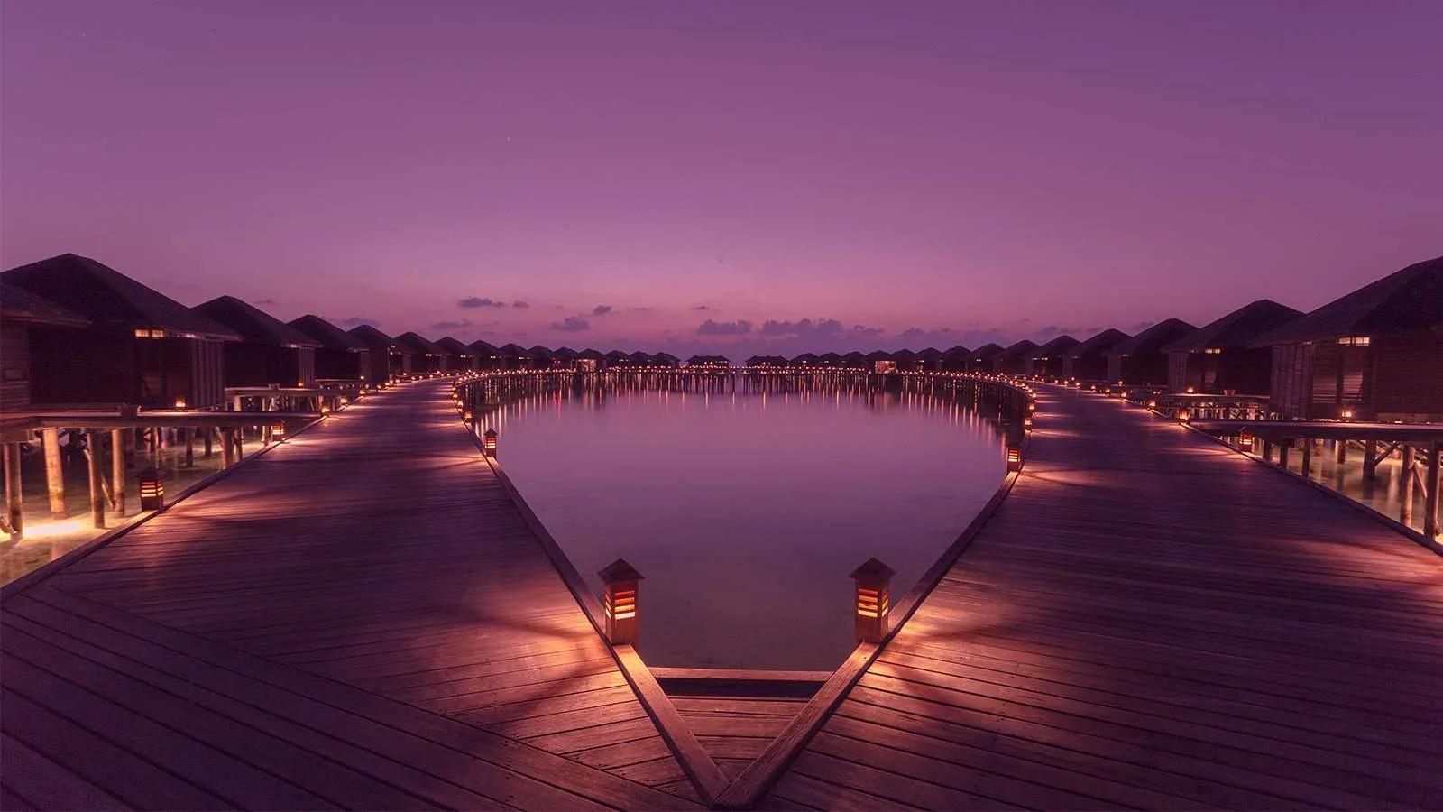 Sunset over the lagoon at Lily Beach Resort & Spa