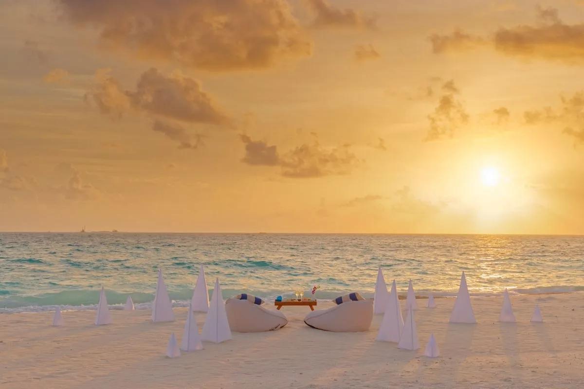A private sunset dinner set up on the beach, part of the resort's F&B Experiences programme