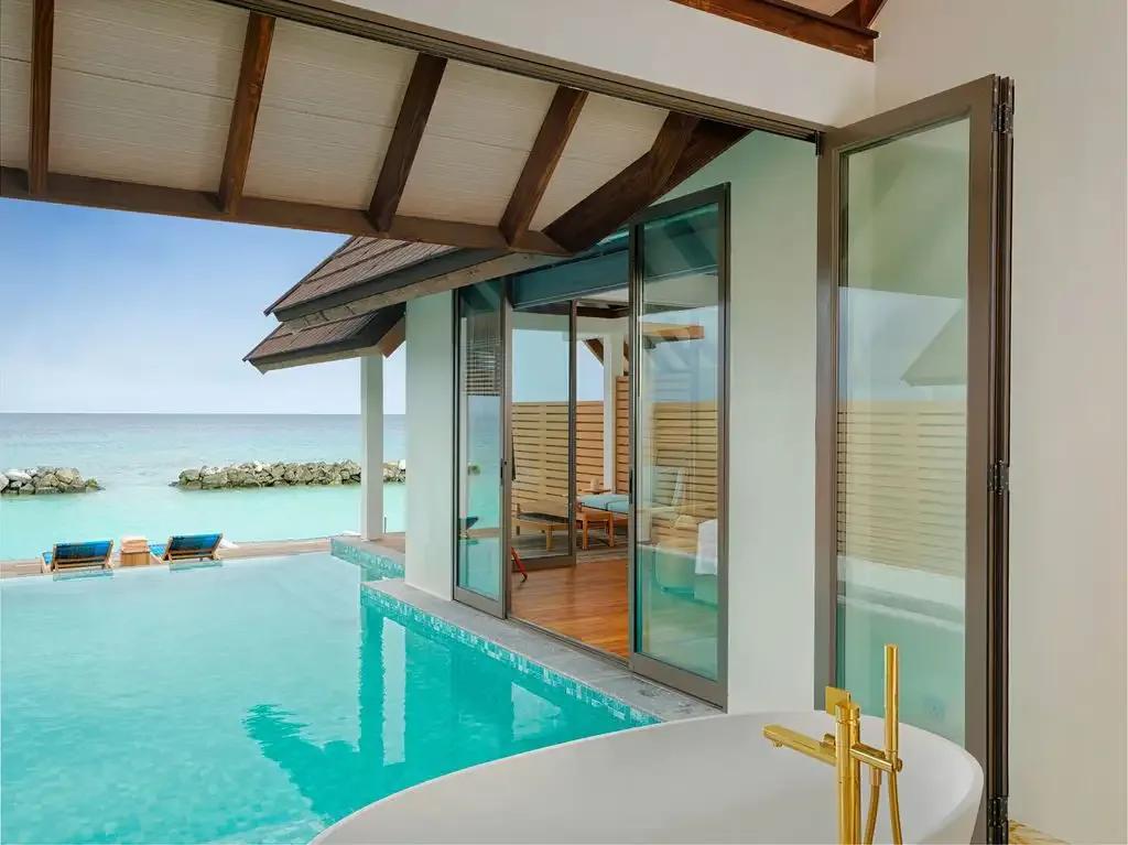 A Semi-Ocean Pool Suite's bedroom and terrace, the resort's only villa image below 1200px at source