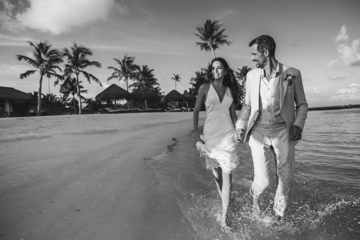 A solitary walk along the waterline of an empty Maldives beach
