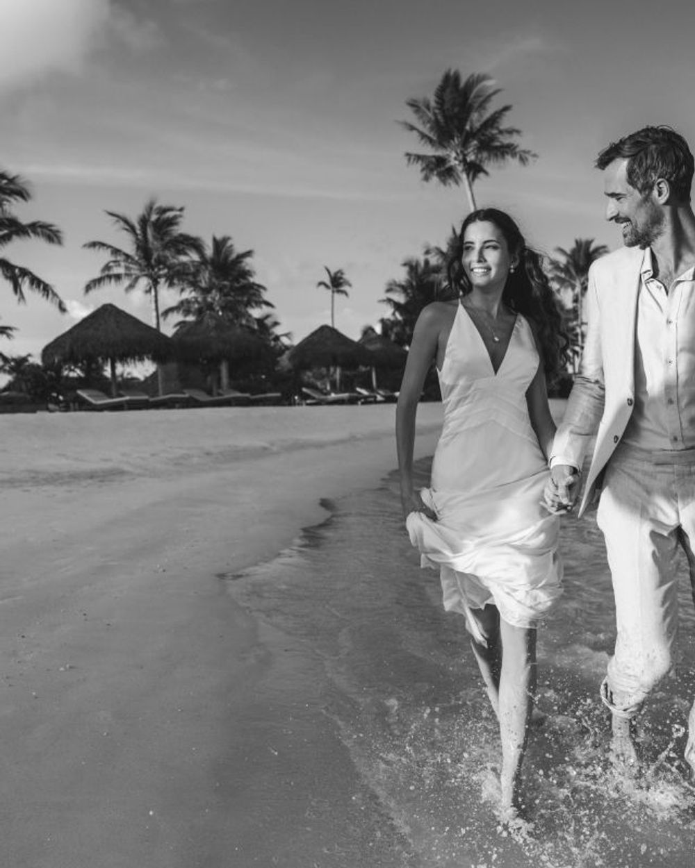 A solitary walk along the waterline of an empty Maldives beach