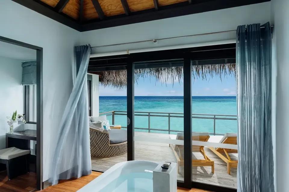Water Villa's overwater deck and open ocean view, with steps down toward the lagoon