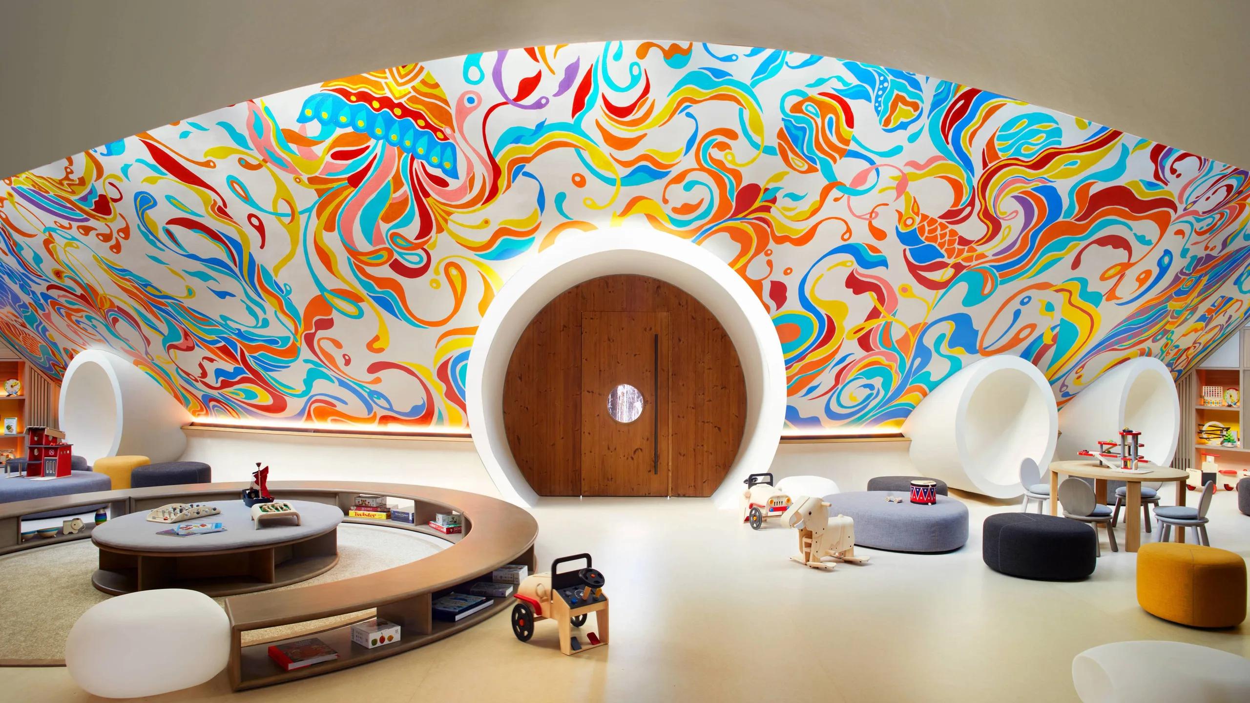 Ritz Kids' playroom, its domed ceiling covered in a bright hand-painted mural