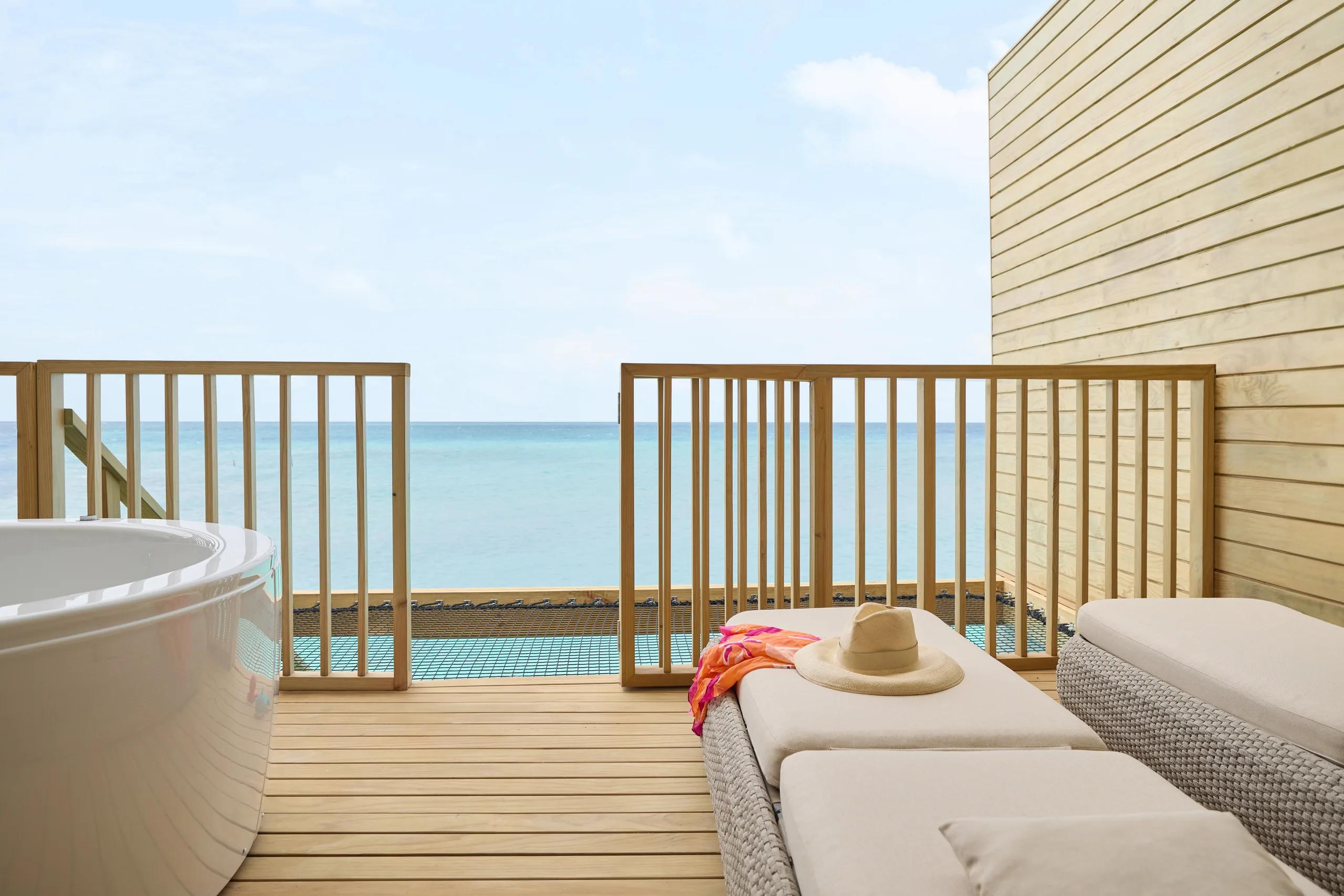 A Mirage Overwater Sunset Villa with Jacuzzi, deck facing the sunset side of the lagoon