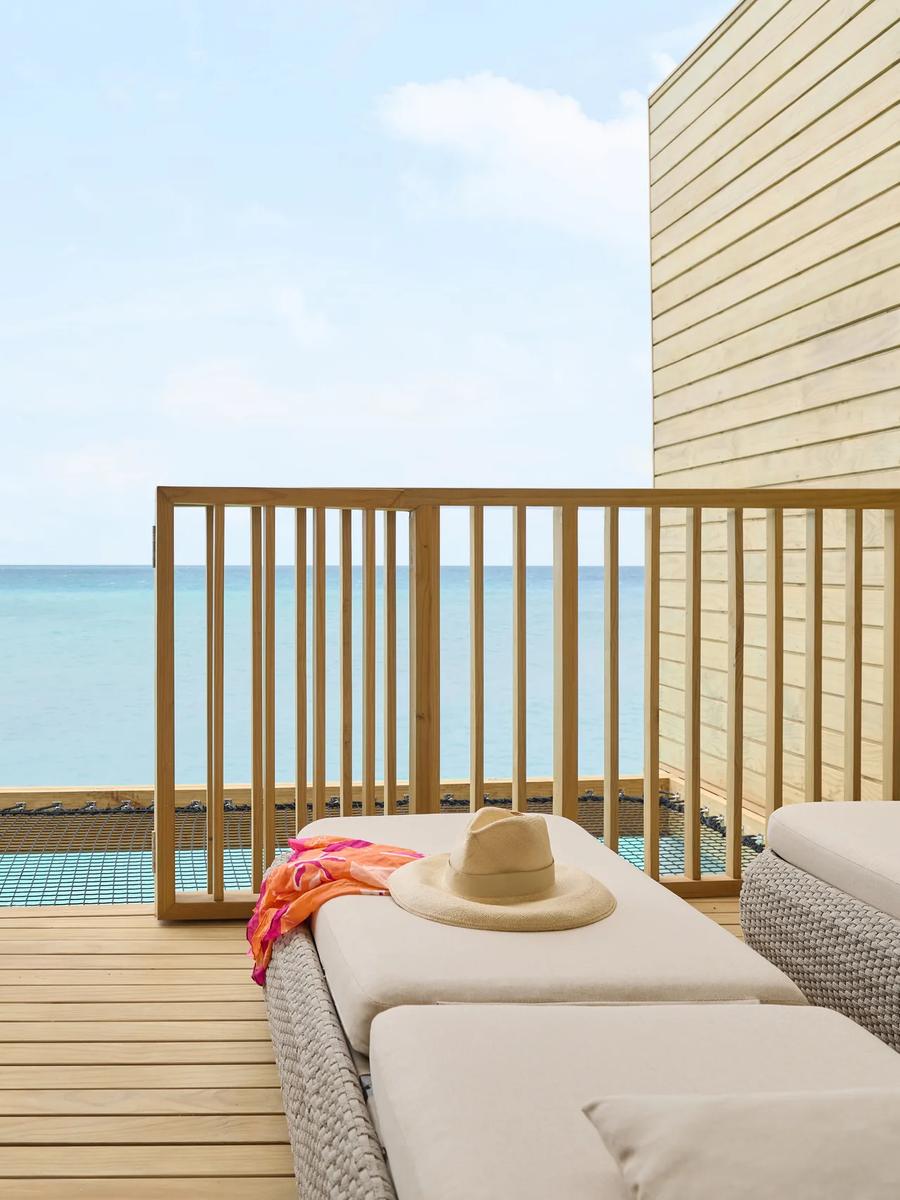 A Mirage Overwater Sunset Villa with Jacuzzi, deck facing the sunset side of the lagoon