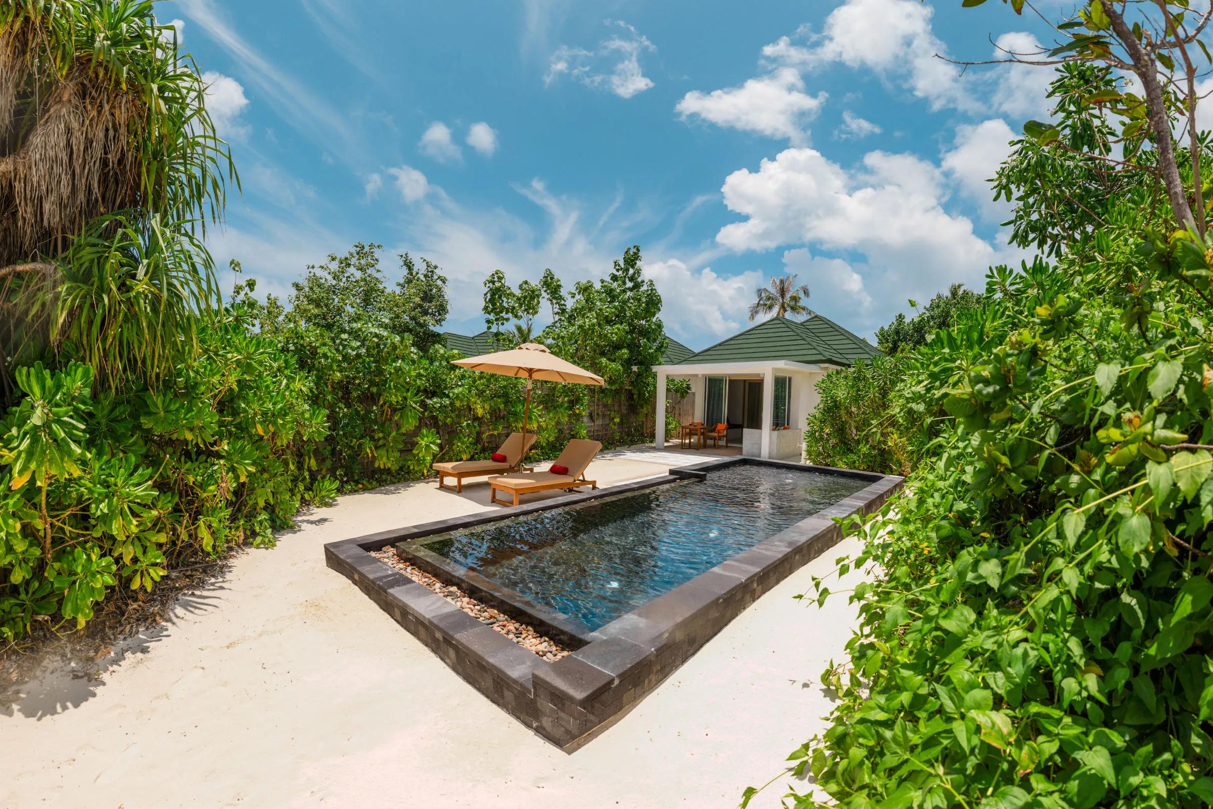 A beachfront setting at Siyam World; a dedicated photograph of The Cube, the resort's glass beach-cube chef's table, to follow