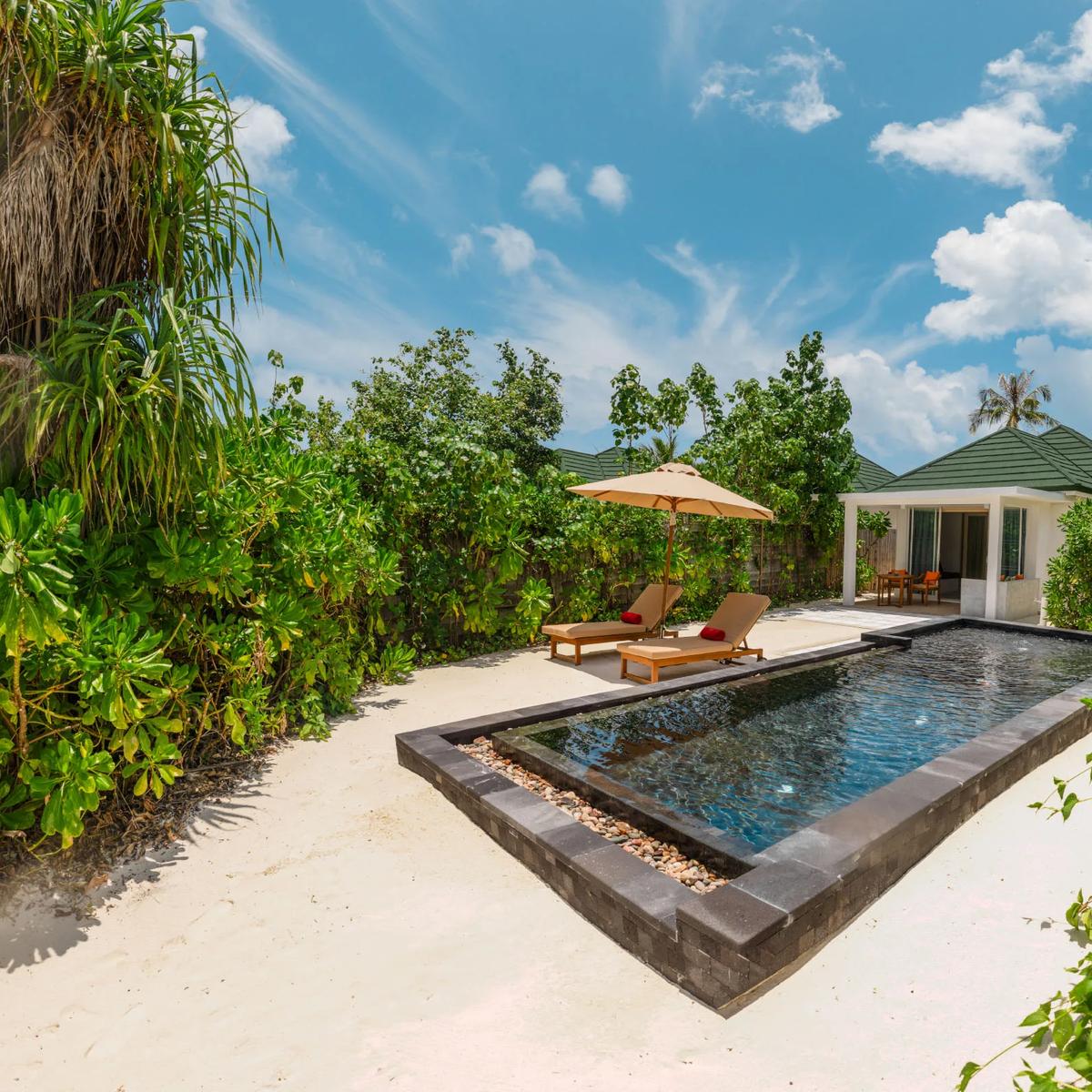 A beachfront setting at Siyam World; a dedicated photograph of The Cube, the resort's glass beach-cube chef's table, to follow