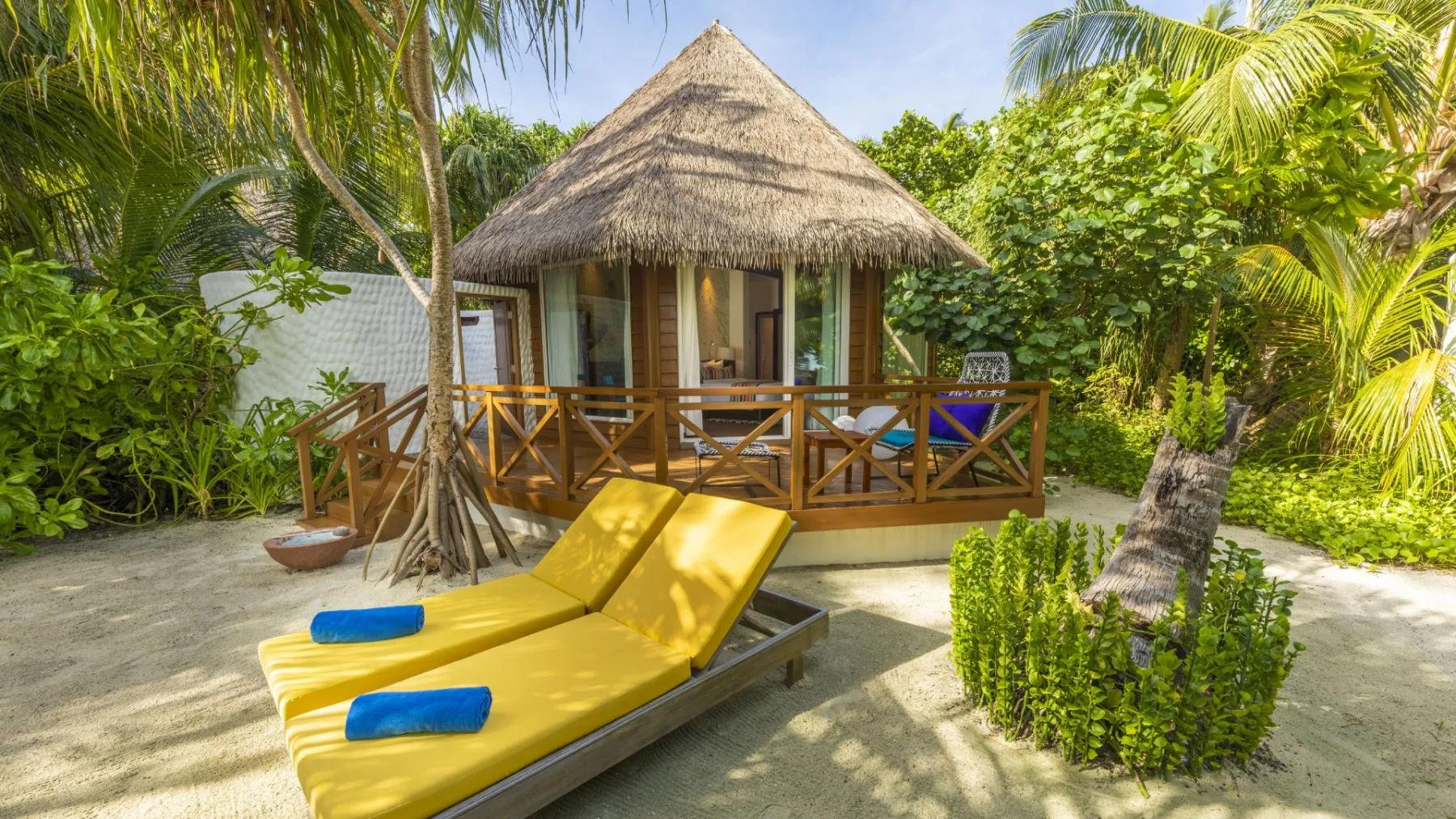 A Beach Villa's exterior and terrace at Mercure Maldives Kooddoo Resort