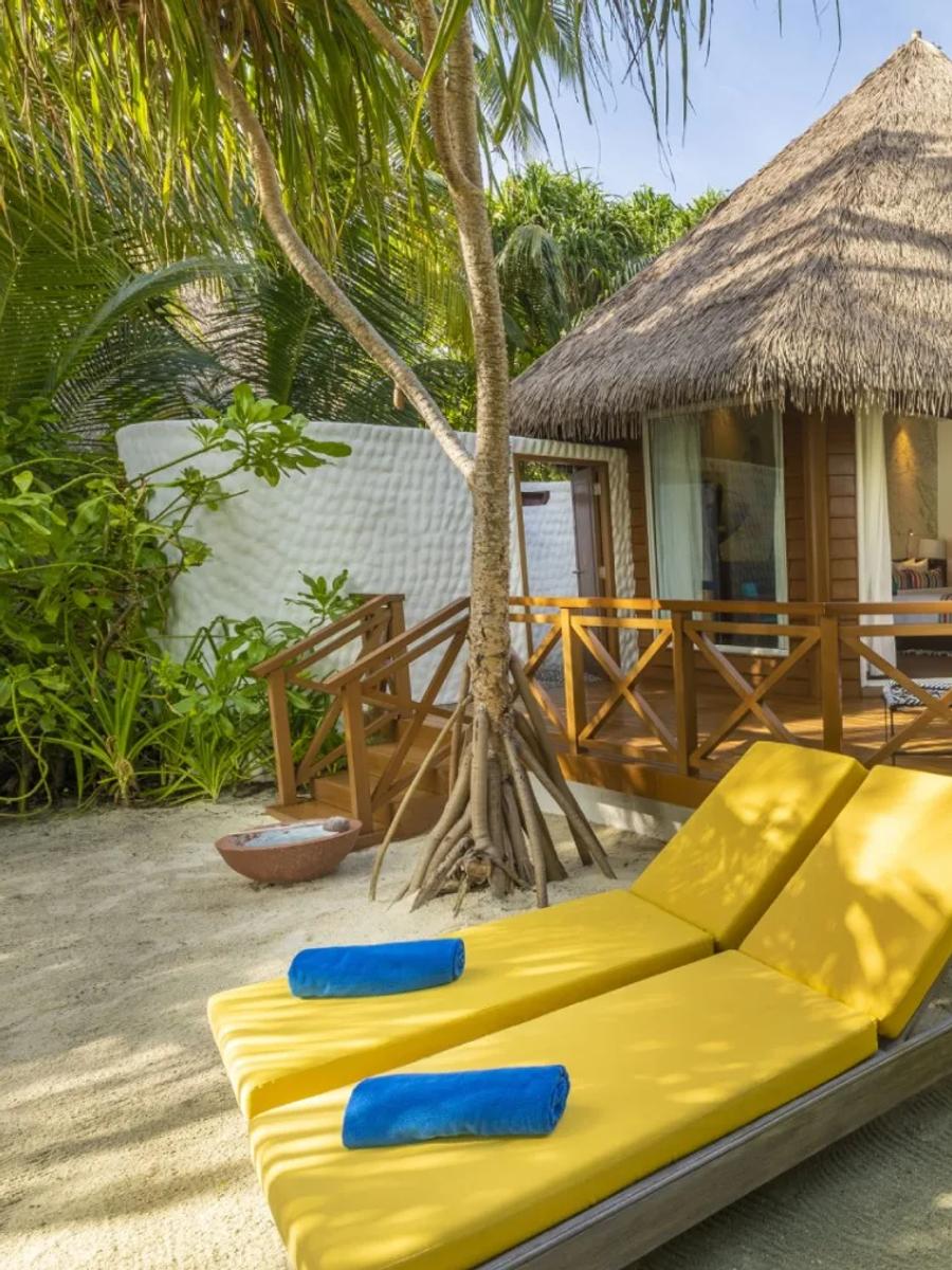 A Beach Villa's exterior and terrace at Mercure Maldives Kooddoo Resort