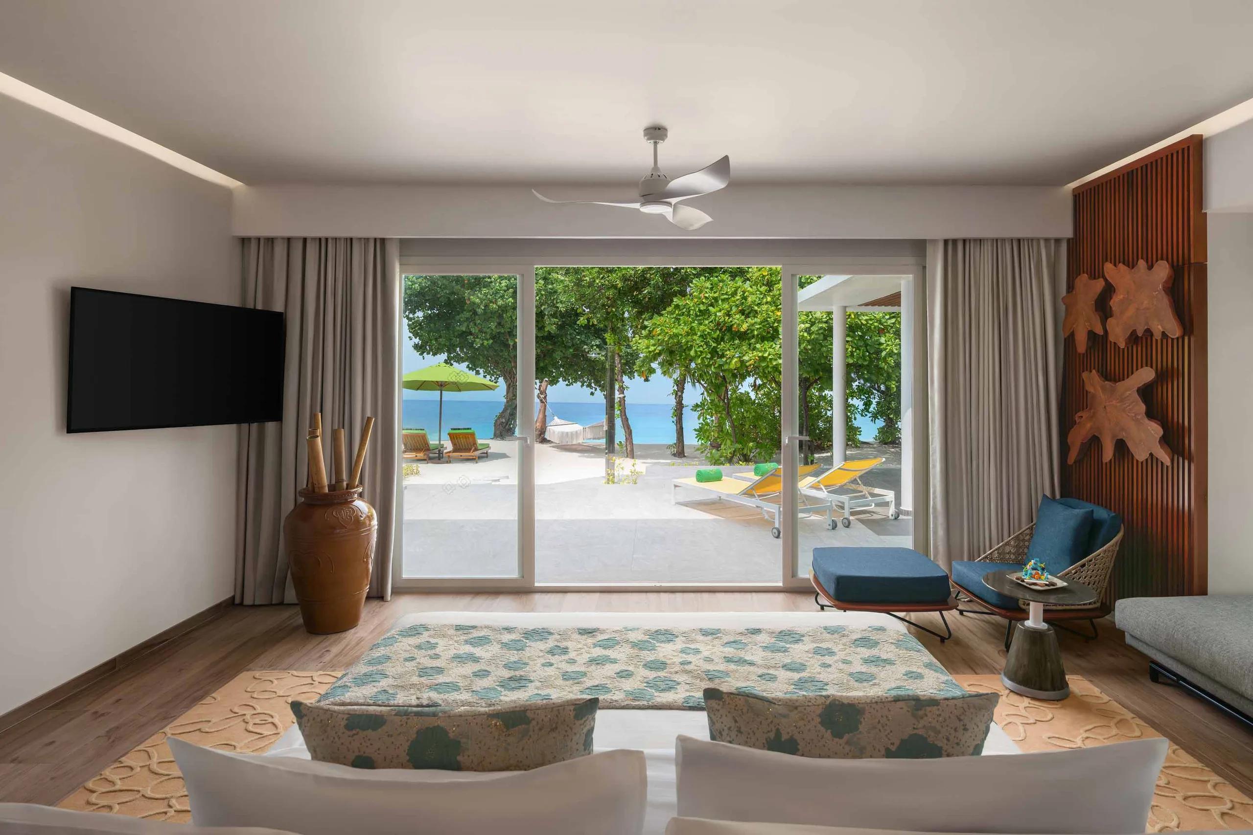 The two-storey Three Bedroom Royal Beach Villa with Pool, its 900 sqm footprint around an 8x3 m pool