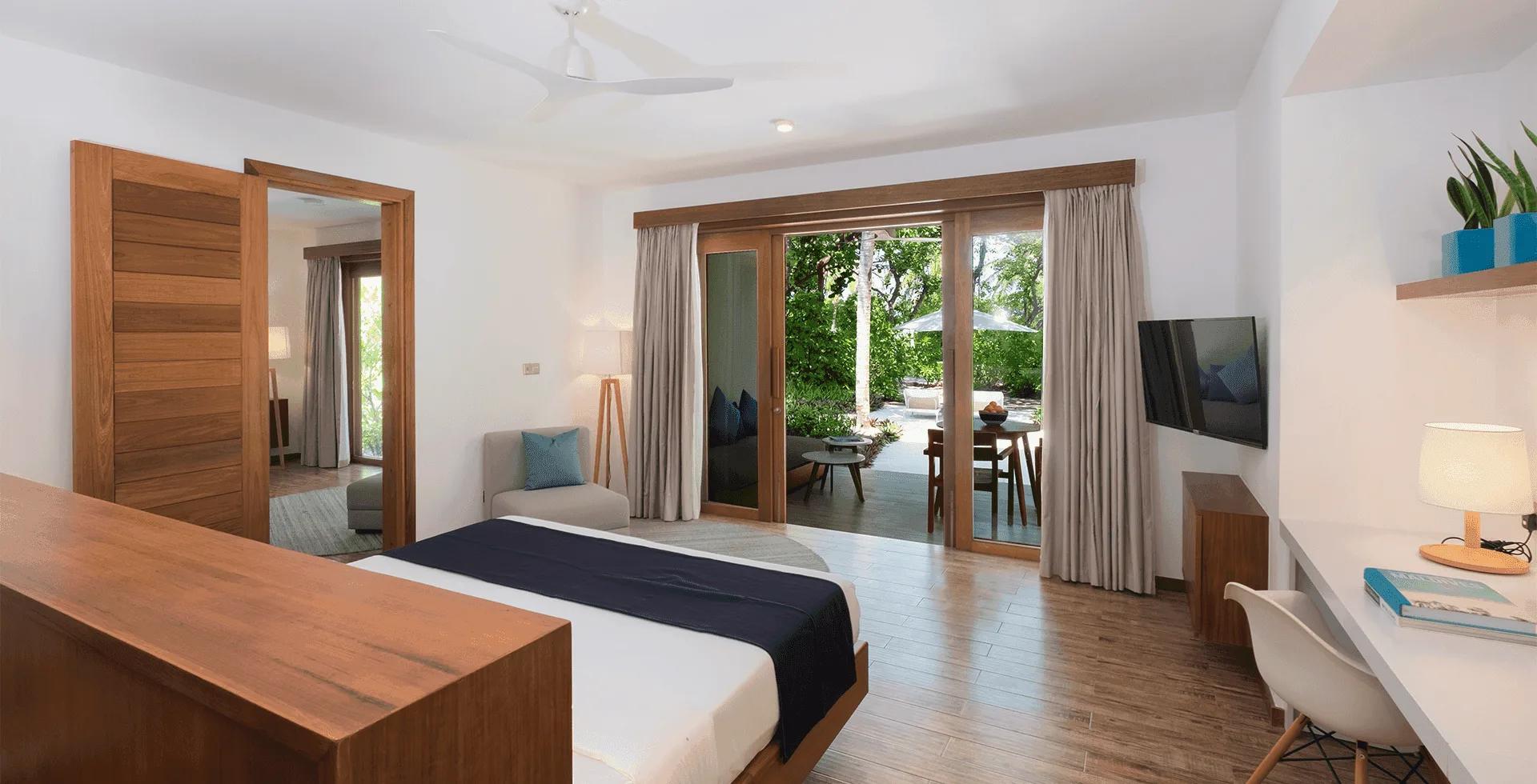 The interconnecting bedrooms of a Sunset Family Beach Suite at Ifuru Island Maldives